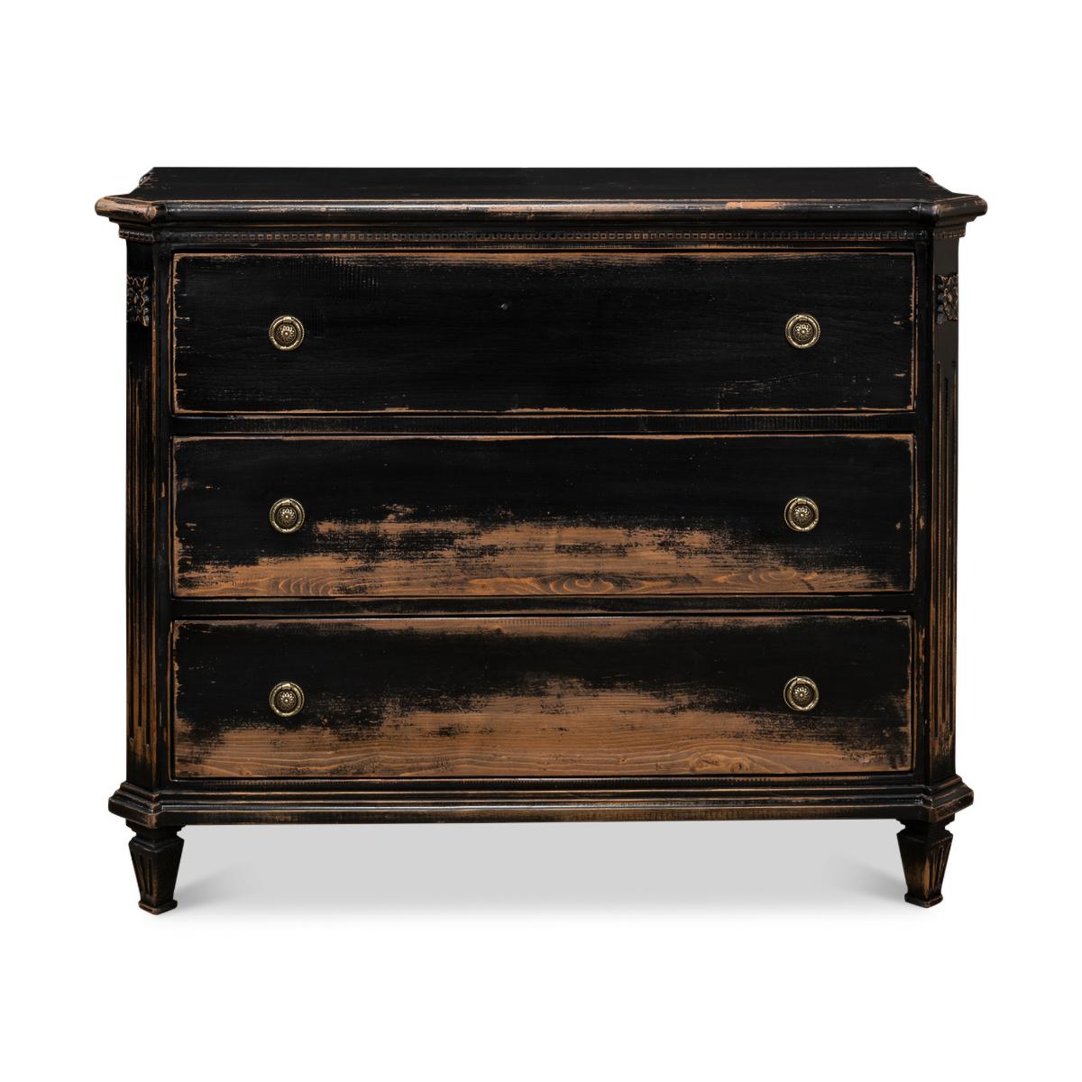 Louis XVI Style Antiqued Black Commodes with an antiqued and distressed rub through black painted finish. With canted corners, dental molding, and three long drawers each with ring handles, raised on square tapered legs.

Dimensions: 47