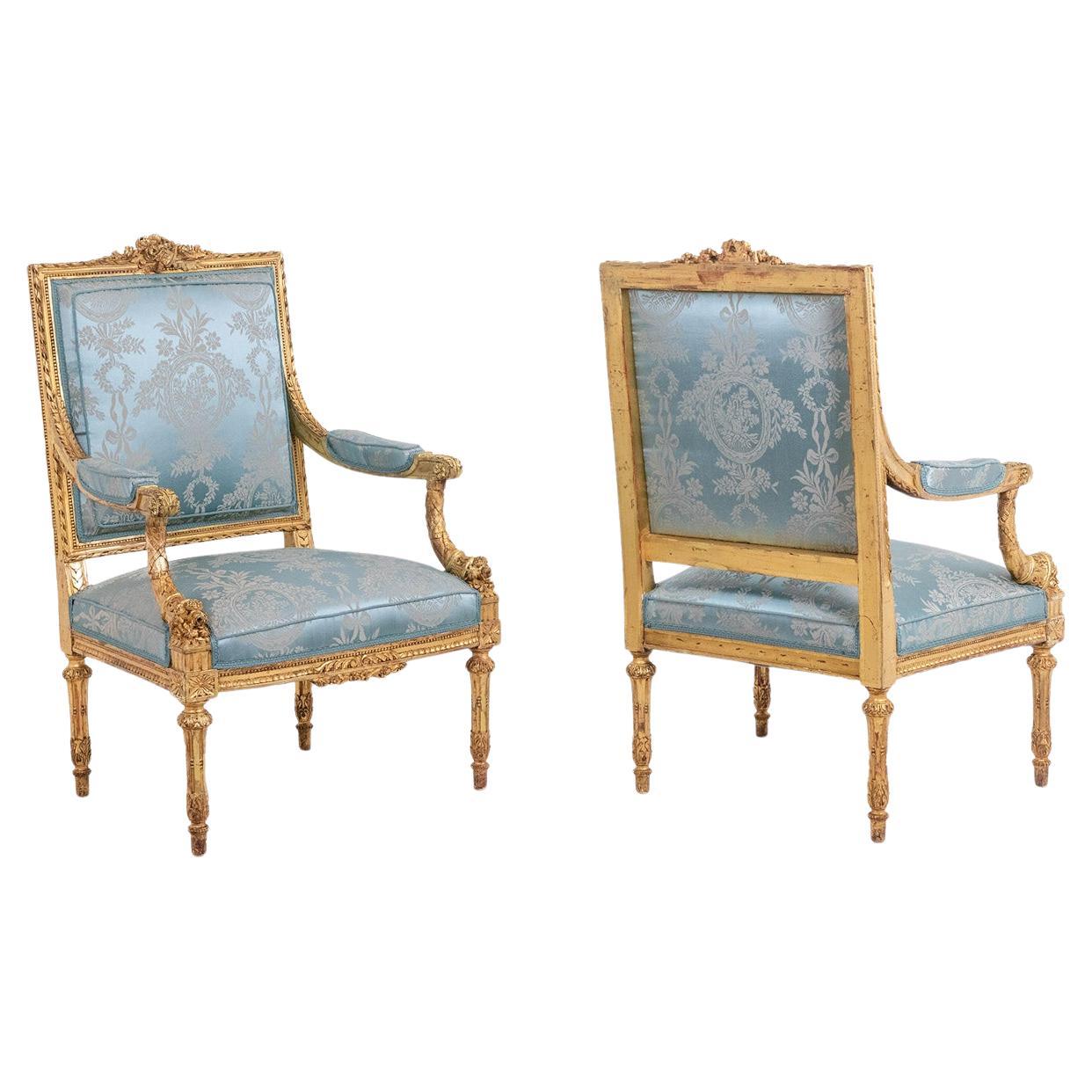 Pair of Louis XVI style armchairs in gilded and carved wood. Circa 1880.
