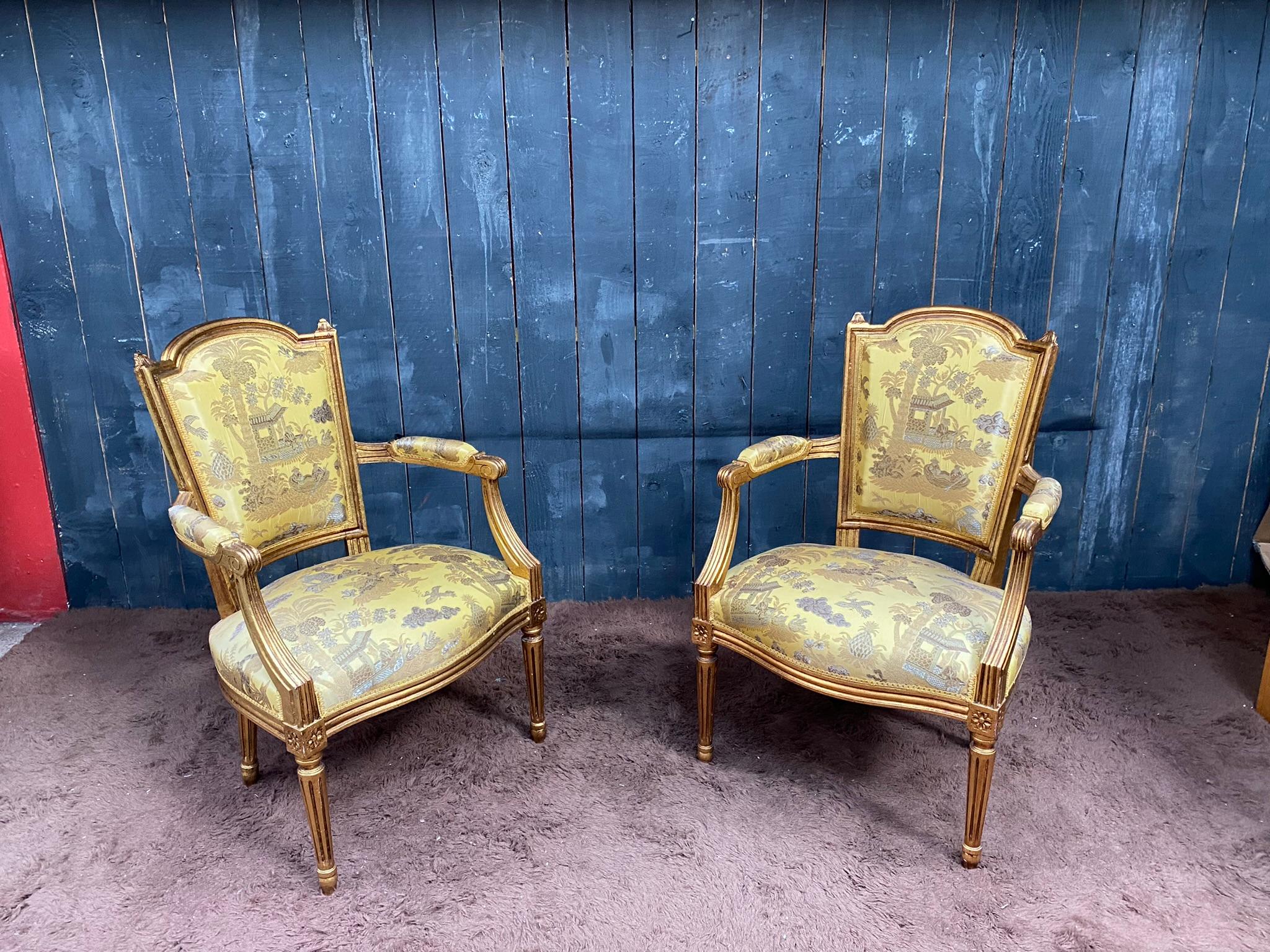 French Pair of Louis XVI style armchairs in gilded wood, 