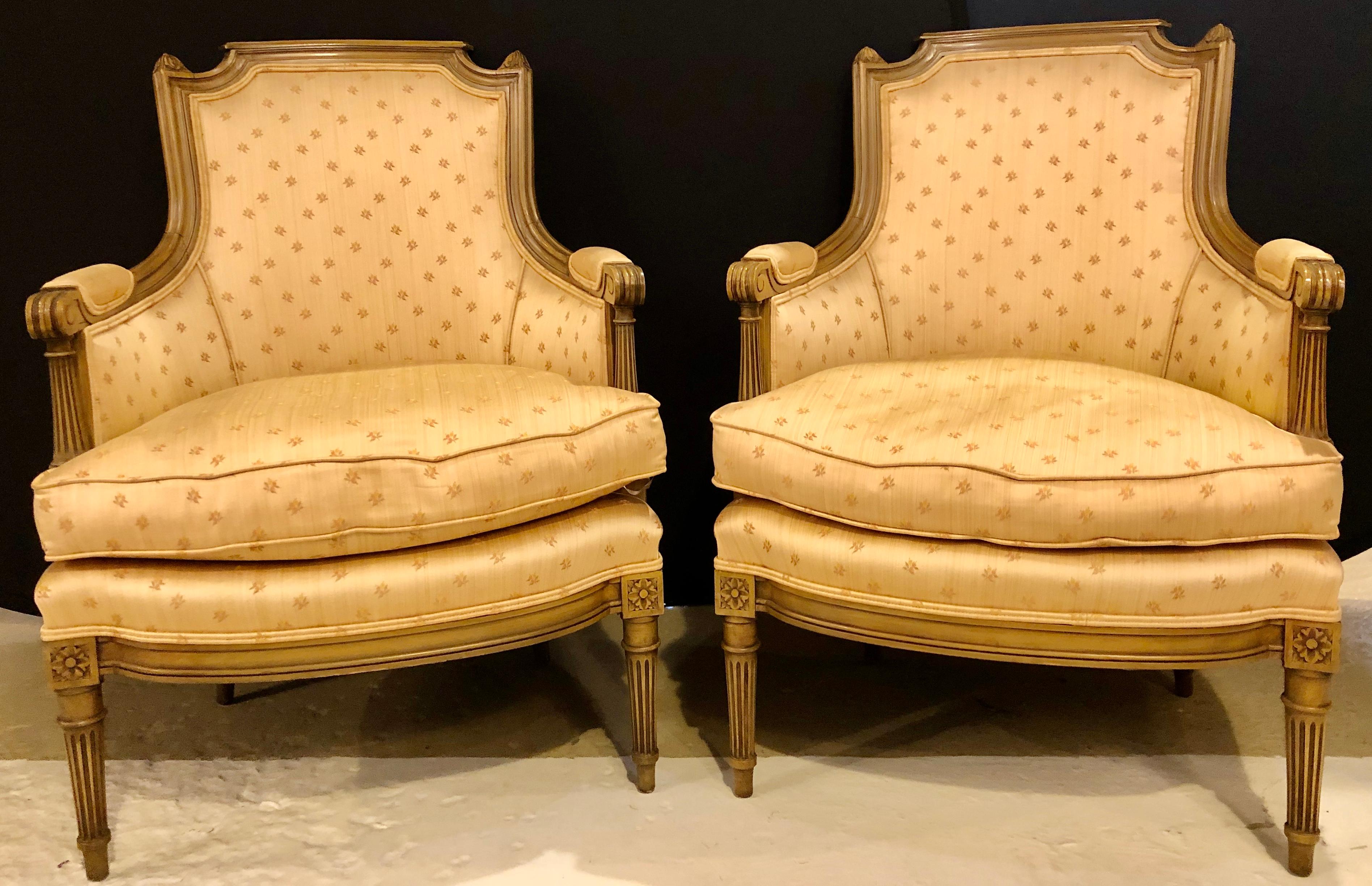 Pair of Louis XVI style bergère chairs. Armchairs in the Maison Jansen style from France in a nice clean Scalamandre fabric. These lovely bergère chairs are sure to add charm to any setting.