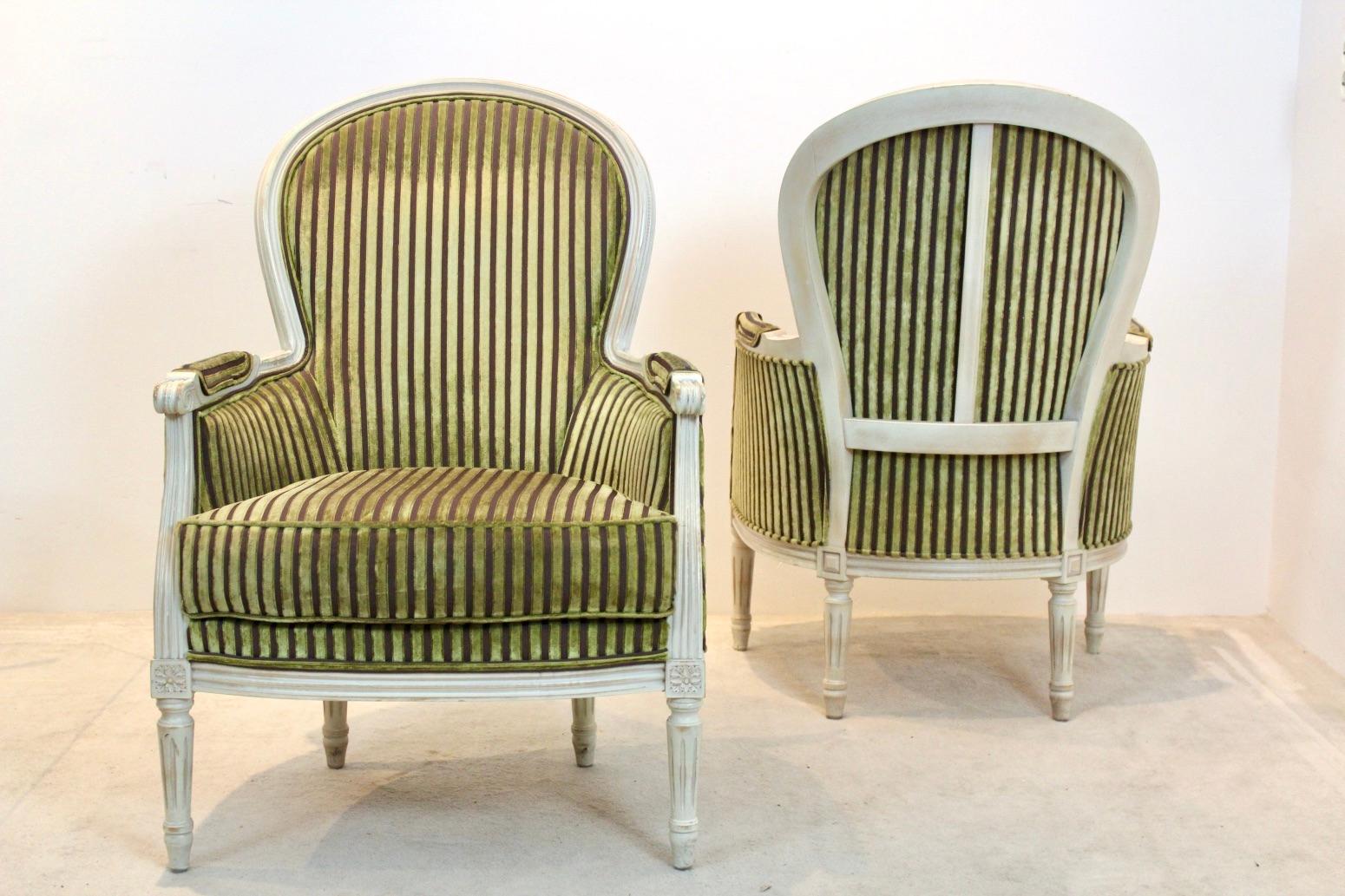 Beautiful and extraordinary pair of neoclassical French Louis XVI style chairs with the original upholstery. Manufactured by Rosello Paris, France. A fine set of two wooden Bergère chairs in very good condition and with a very beautiful patina. The