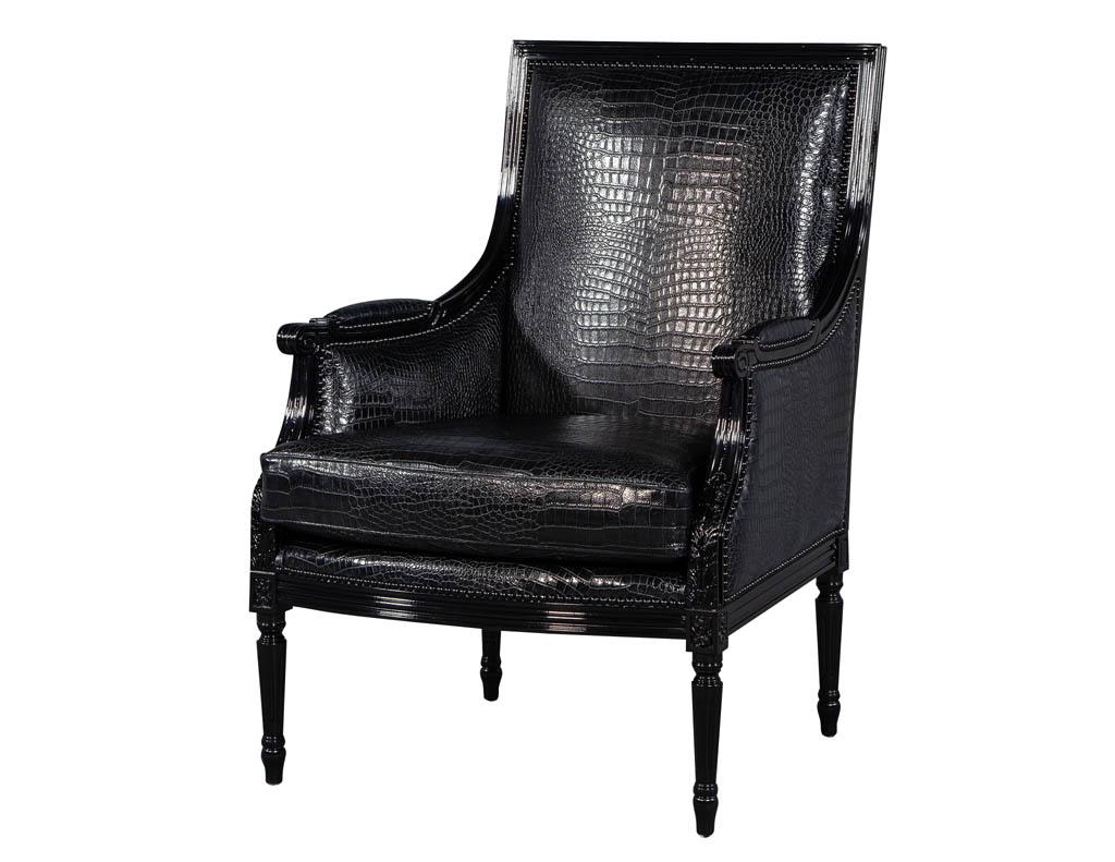 Pair of Louis XVI style bergère club lounge armchairs in croc leather. Upholstered in a croc embossed leather and hand polished to a high gloss mirror finish these chairs create a dynamic outstanding impact, with hand applied head to head furniture