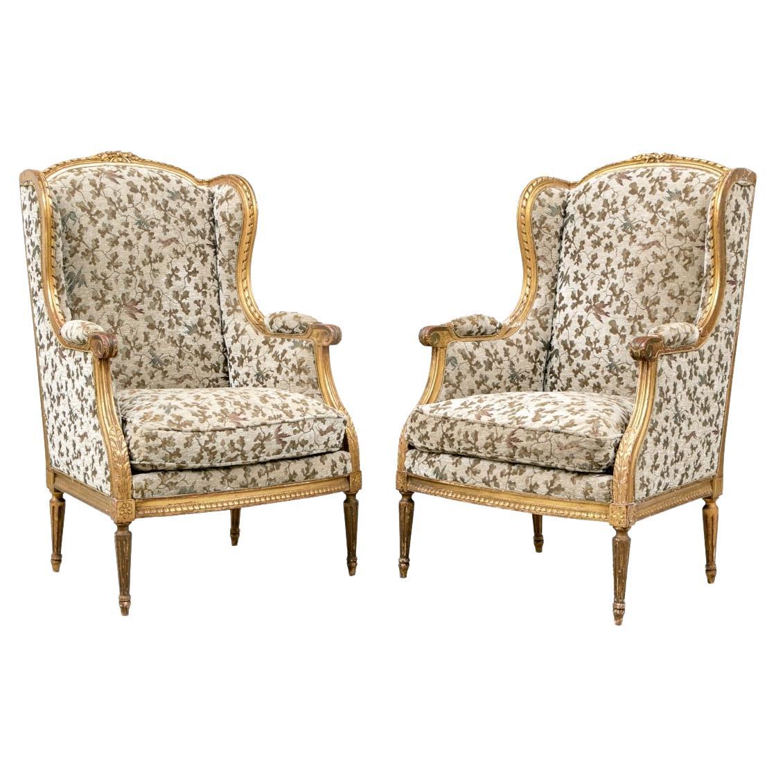 Pair Of Louis XVI Style Bergeres In A Carved Gilt Finish