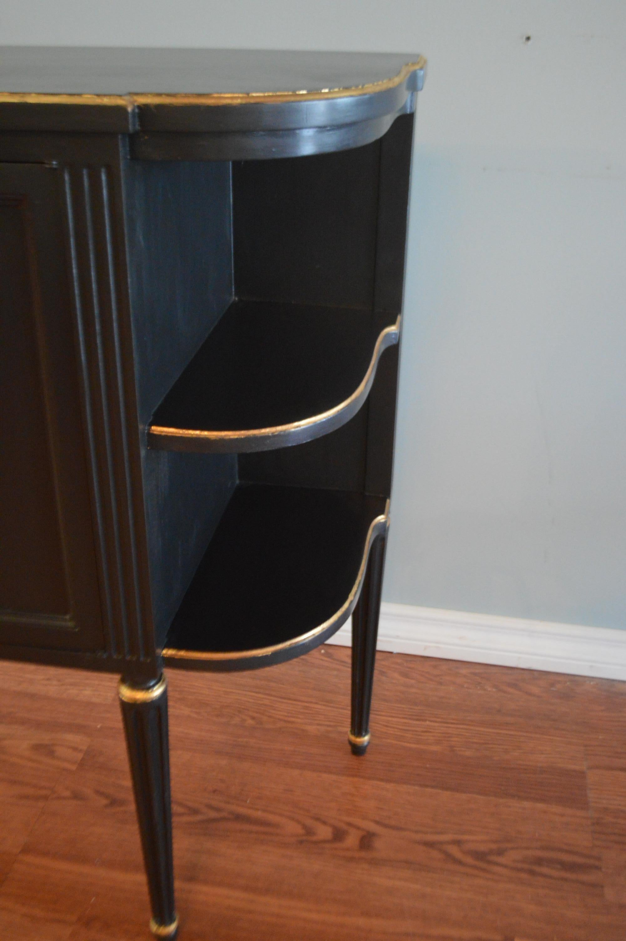 French Pair of Louis XVI Style Black Demilune Cabinets, Gilt Accents, Two Doors, Shelf