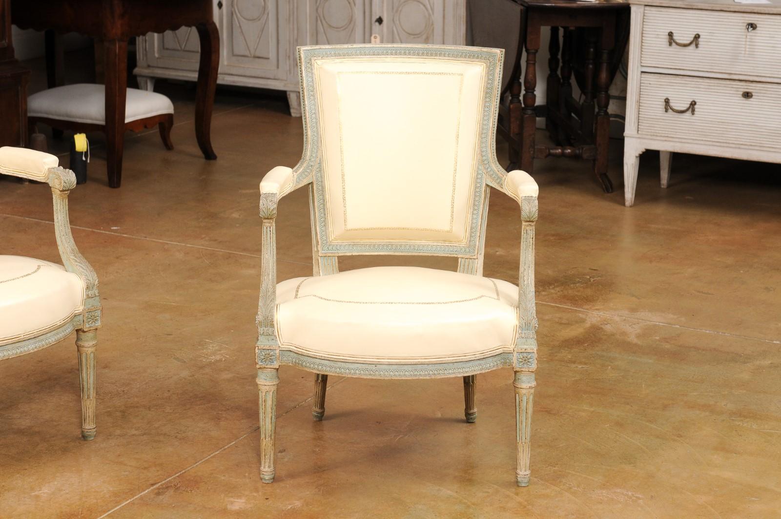 Carved Pair of Louis XVI Style Blue Grey Painted Armchairs Covered in White Leather For Sale