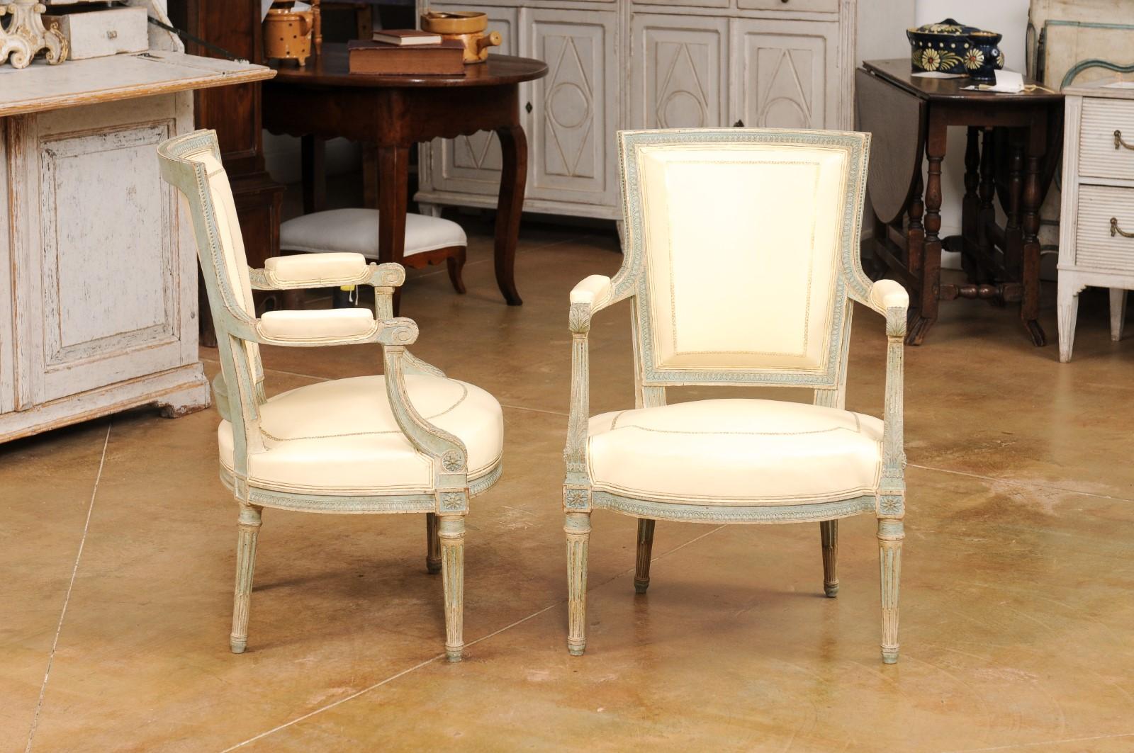 Pair of Louis XVI Style Blue Grey Painted Armchairs Covered in White Leather In Good Condition For Sale In Atlanta, GA