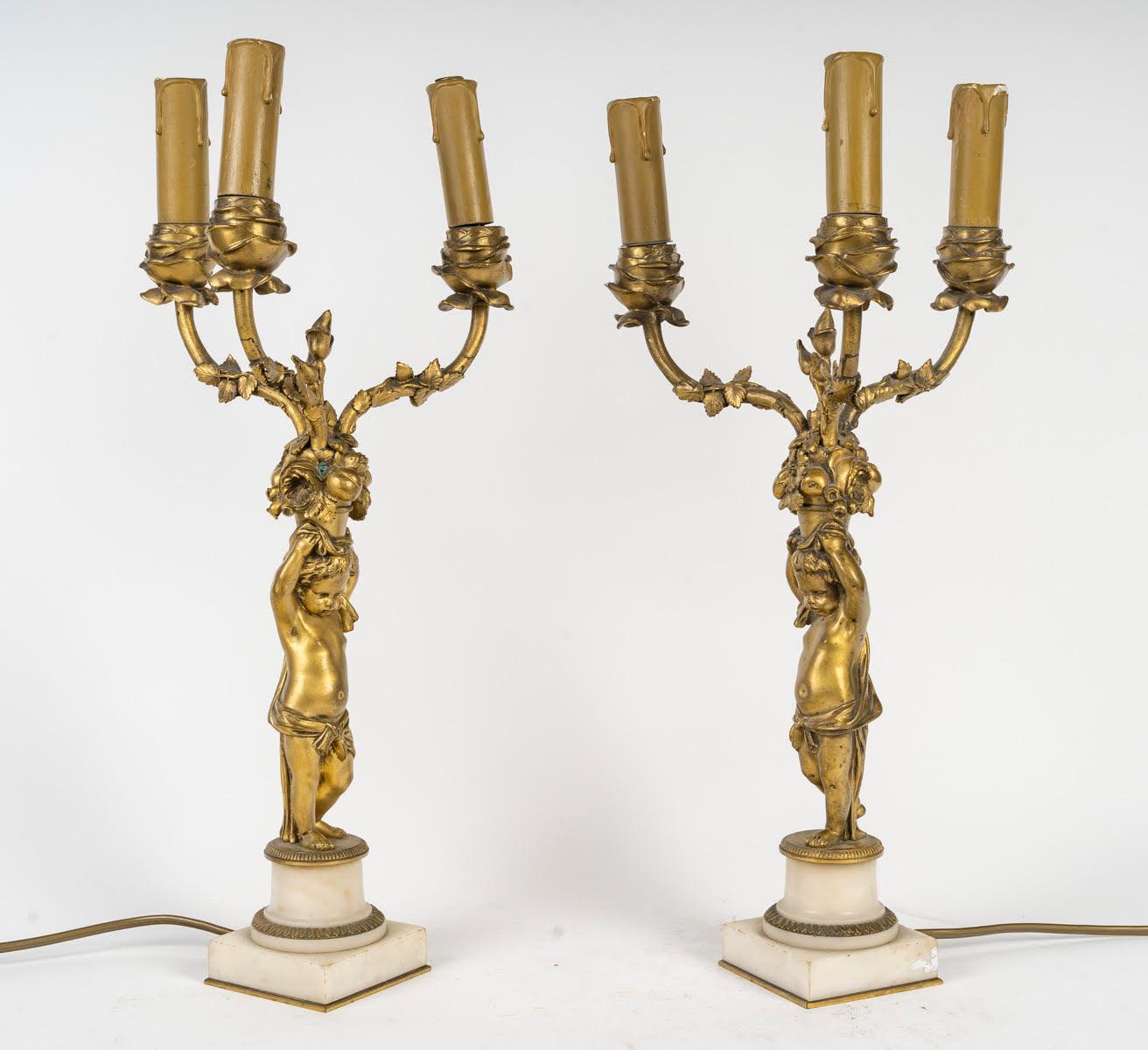 Pair of Louis XVI style candelabra, 19th century, signed Barbedienne.

A pair of gilt bronze candelabra, signed Barbedienne, 19th century, Louis XVI style with three arms of light supported by a Putto, marble base.
H: 44cm, W: 22cm, D: 19cm