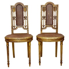 Pair of Louis XVI Style Caned and Gilded Chairs