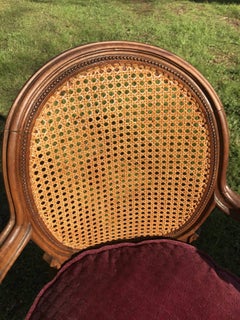 Pair of Louis XVI style caned armchairs