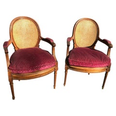 Pair of Louis XVI style caned armchairs