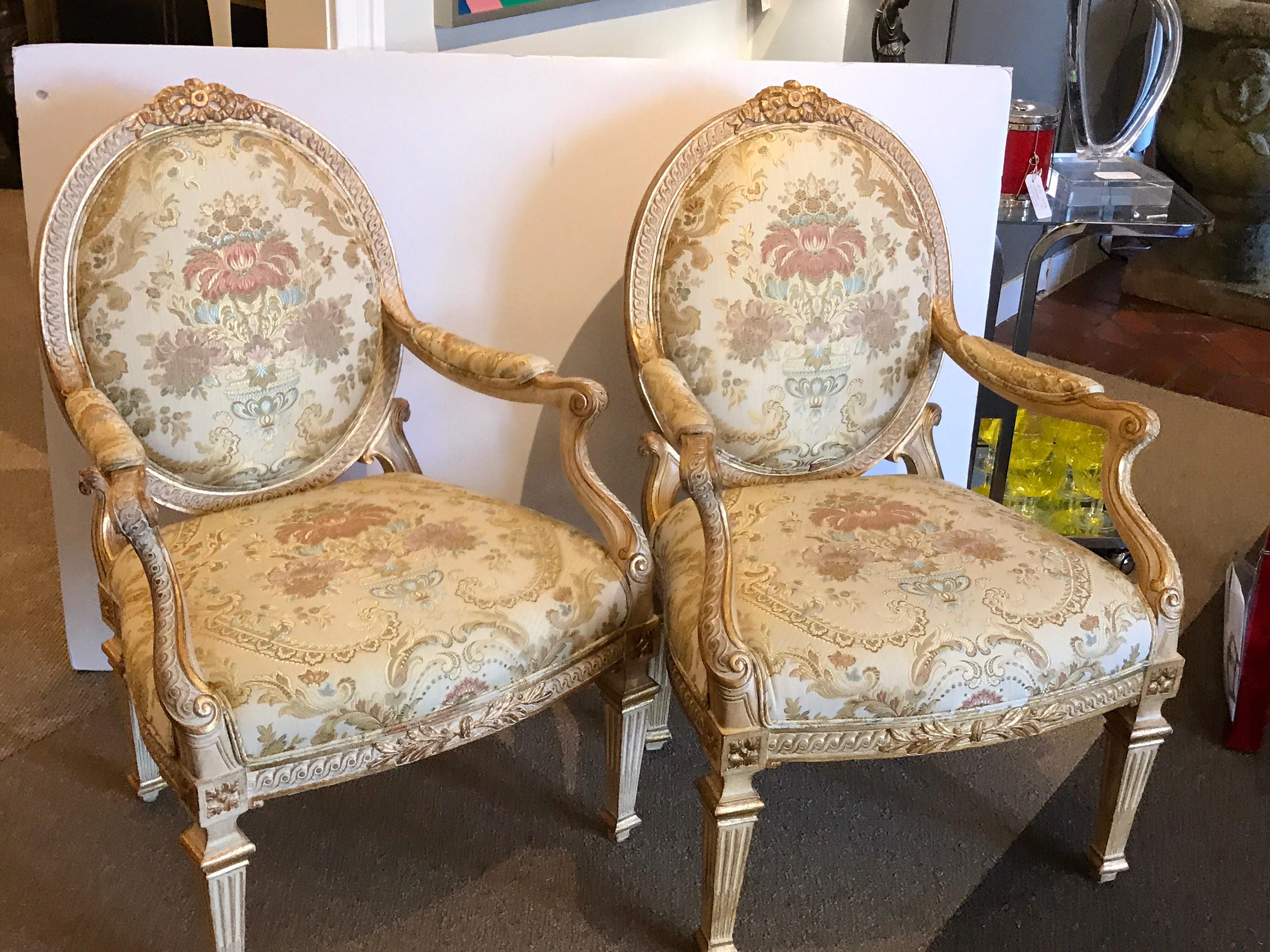 Pair of Louis XVI style carved giltwood bergère chairs with scalamandre fabric, nice generous proportions with parcel gilt relief. Measures: 40