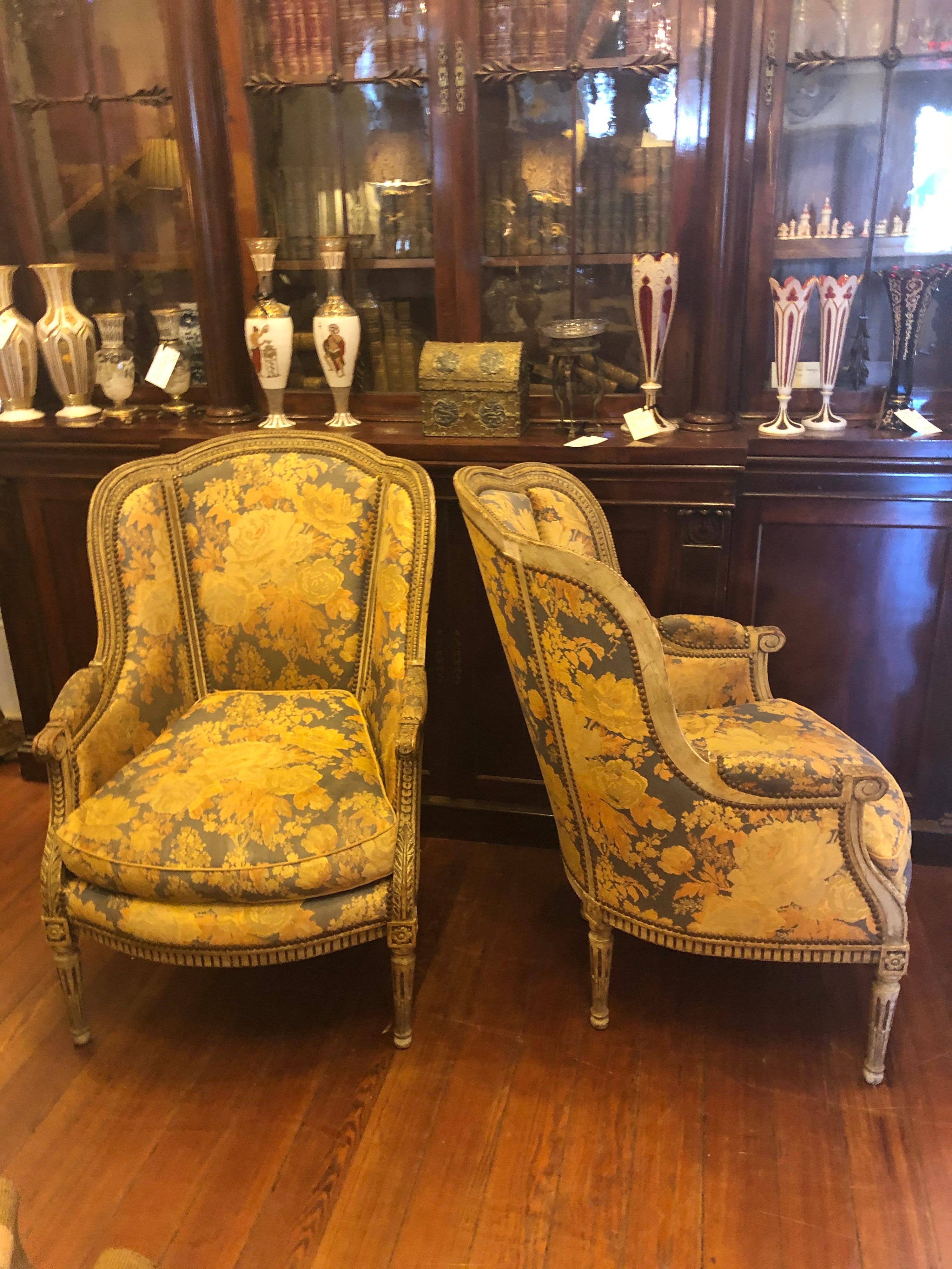 Pair of French Louis XVI wing chairs with incredible carving and pegged joints, early 19th century. Great large scale. Comfortable!