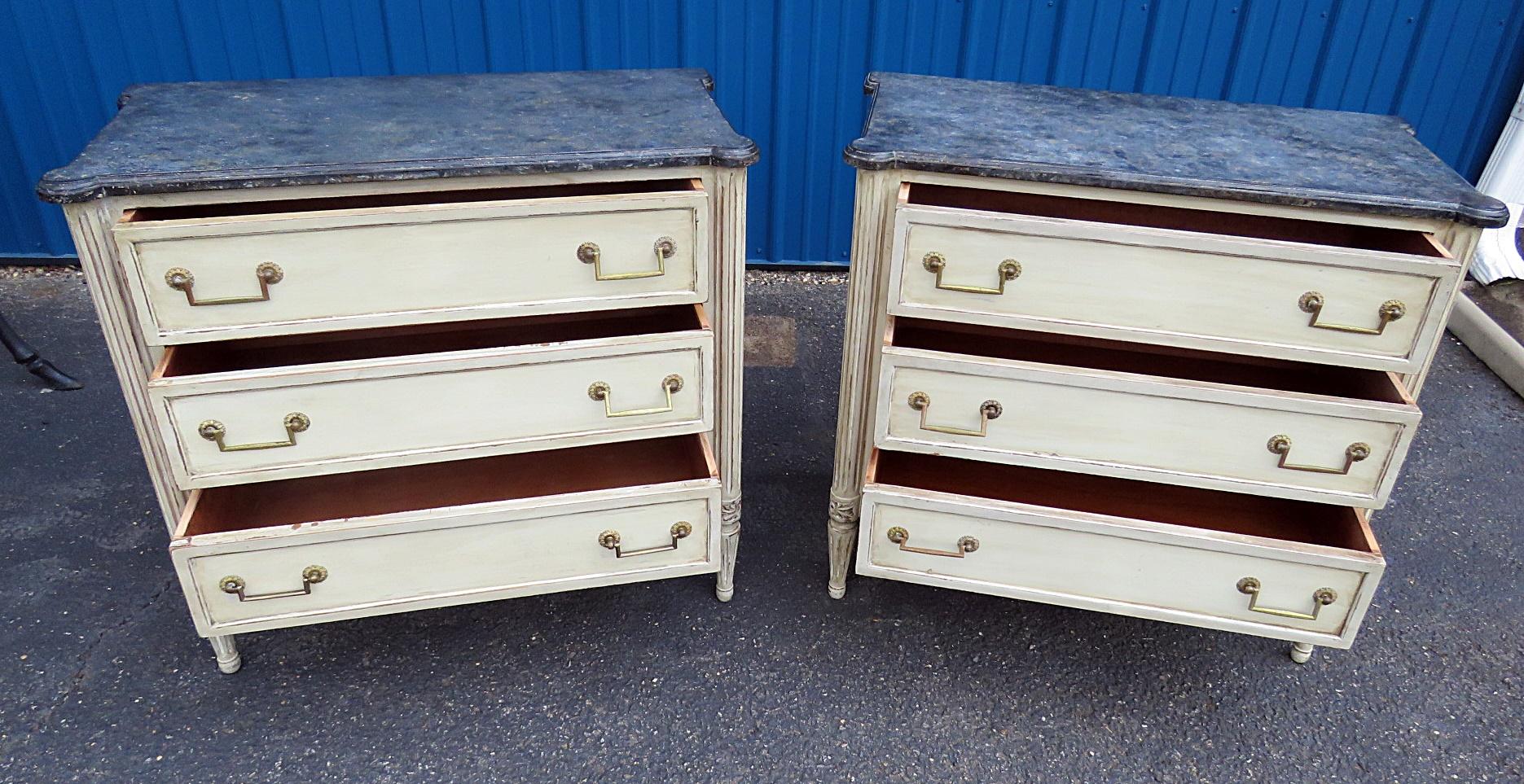 Pair of Louis XVI style faux marble top 3-drawer commodes, with a distressed finish.