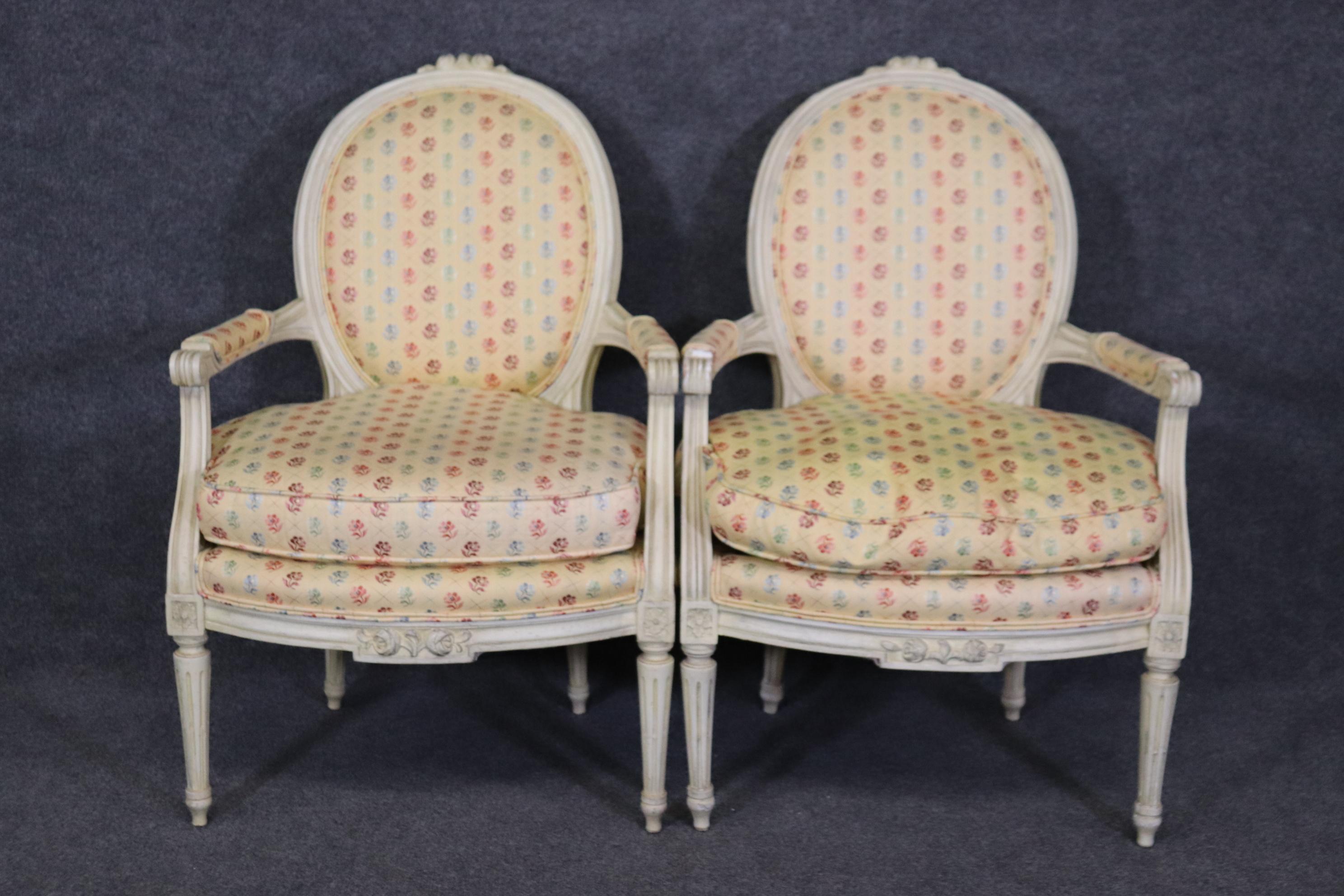 Dimensions- H: 35 1/2in W: 24in D: 25 3/4in SH: 18 1/2in 

This antique pair of Louis XVI style creme paint decorated armchairs accent chairs is perfect for you and your home and is a lovely example of high quality furniture from the 20th century!