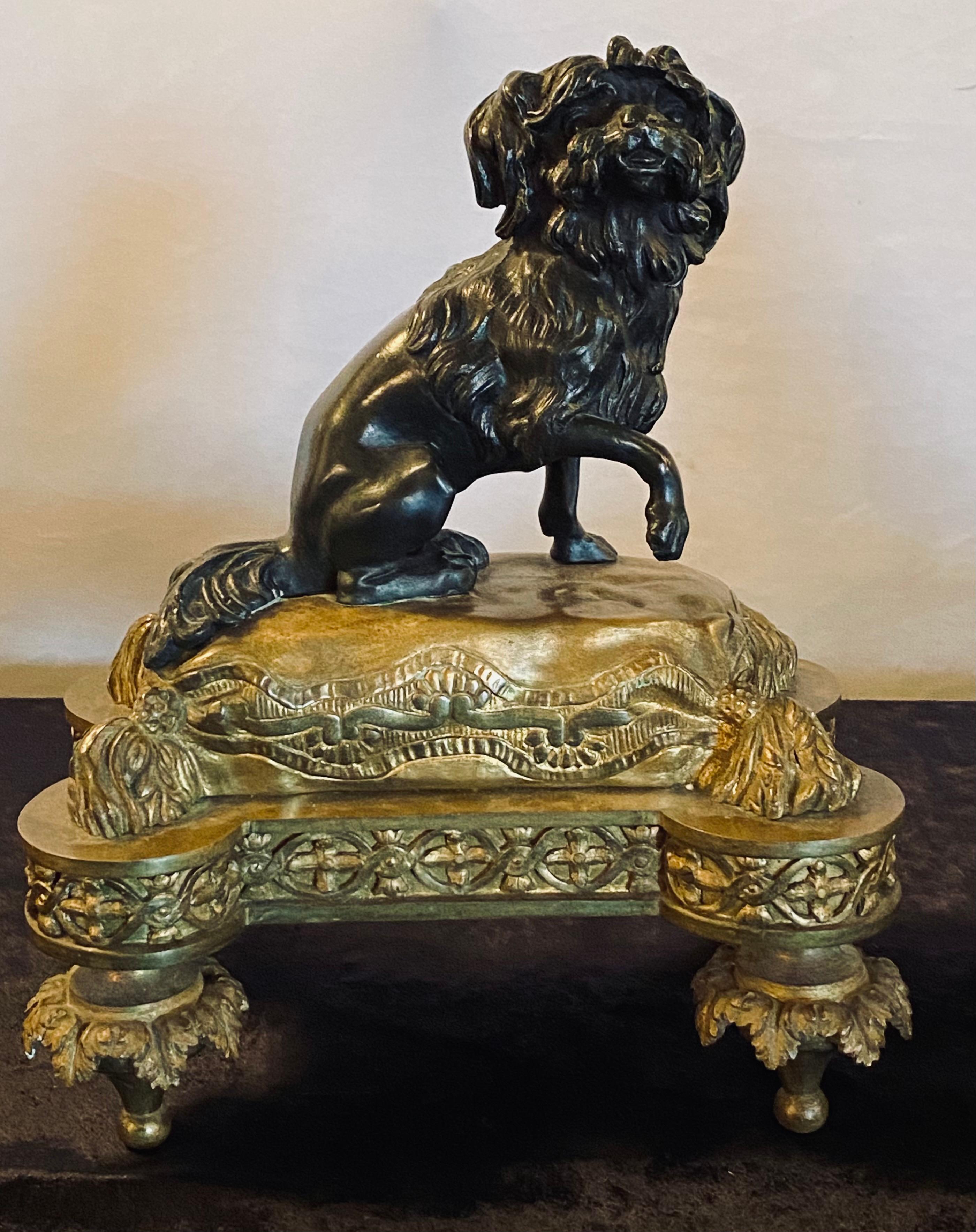 Pair of Louis XVI style 19th century dore bronze chenets. Each having a front facing slightly opposing Poodle wonderfully cast sitting on a gilt tasseled cushion with rounded corners on toupie feet. (description Sothebys NY formally known as Park