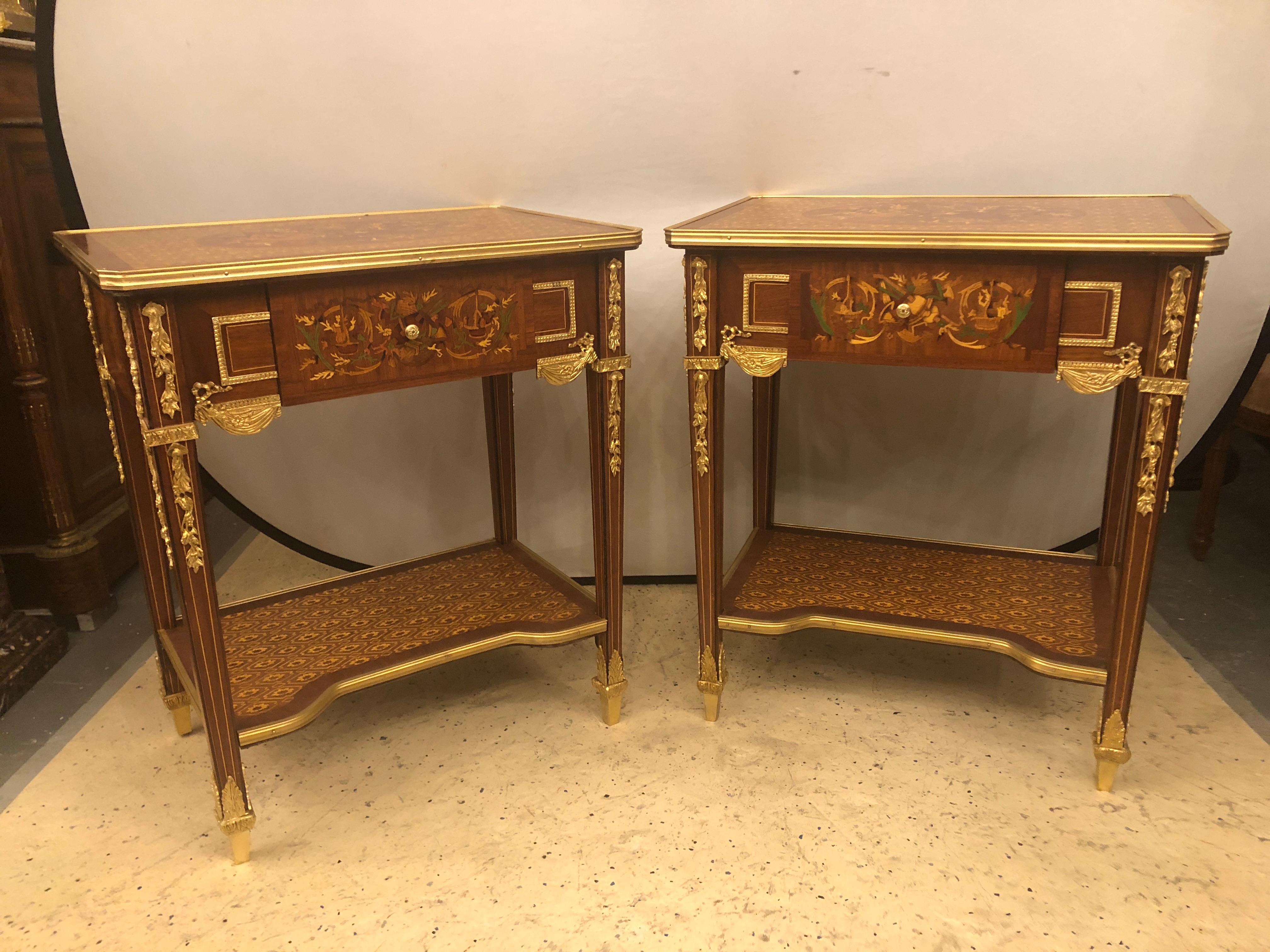 Pair of 19th-20th century Louis XVI style end or lamp tables that can be used as bedroom nightstands with bronze mounts and inlaid drawers. Each of these fine custom quality designer end tables have too much style and grace to mention it all. The