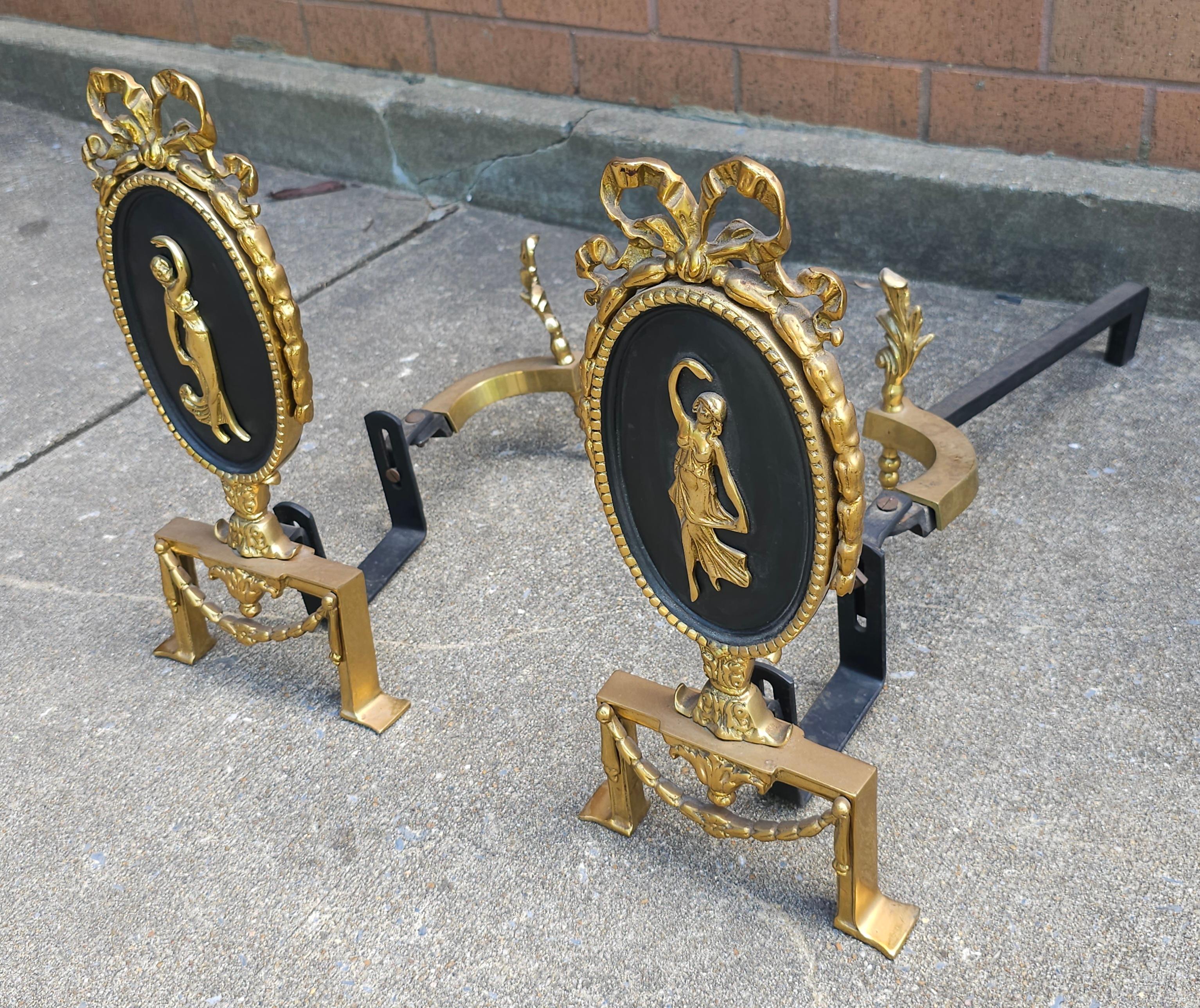French Pair of Louis XVI Style Figural Brass and Iron Ribbon Decorated  Andirons For Sale