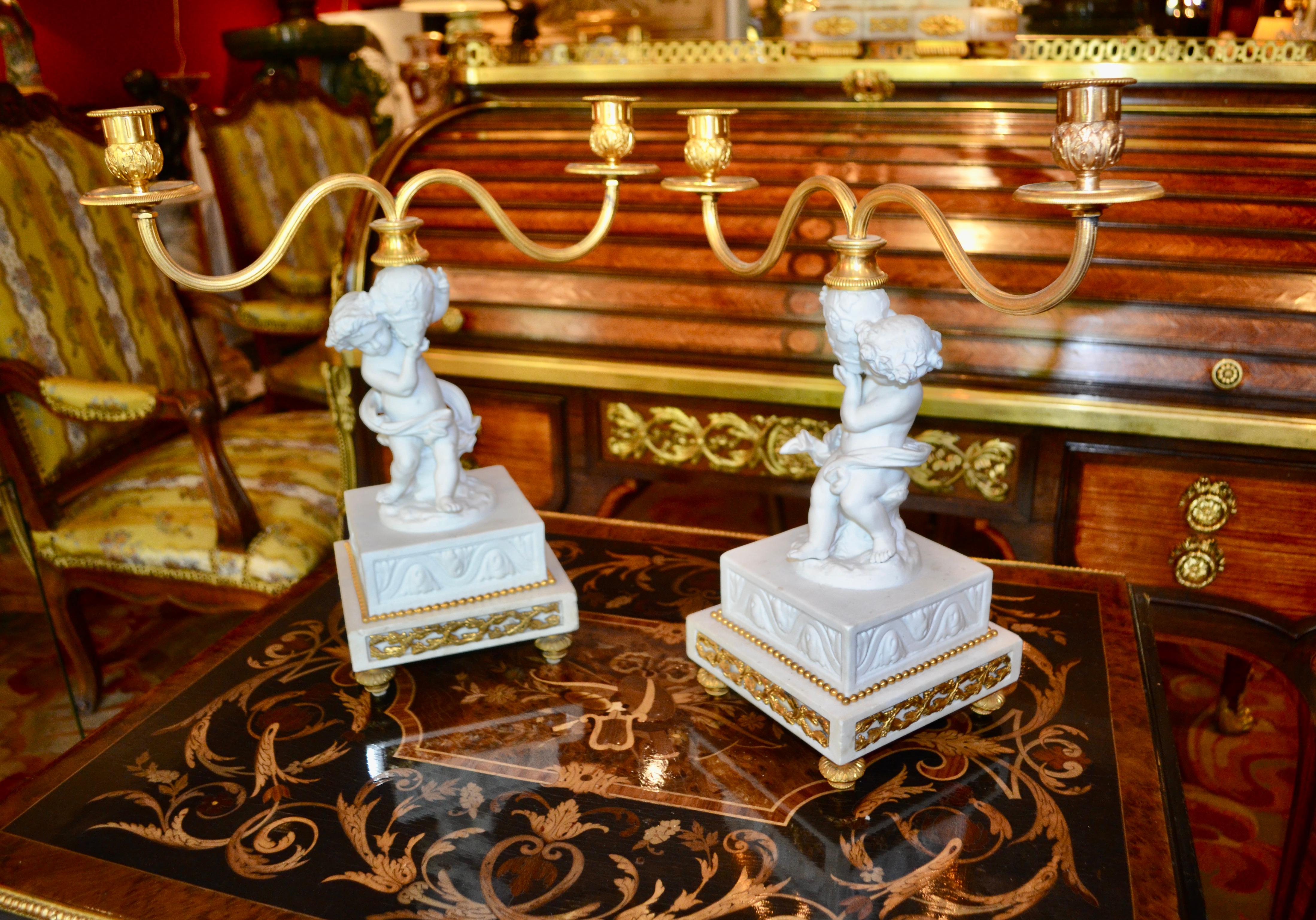 Porcelain Pair of Louis XVI Style Figural White Bisque Candelabra For Sale