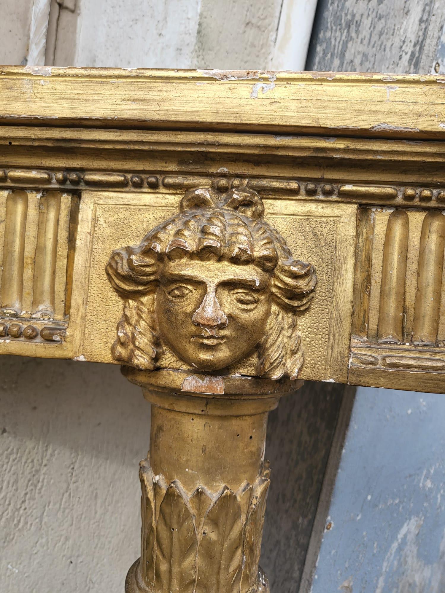 Pair of Louis XVI style gilded wood corner console tables, resting on 1 foot

The band is decorated with a face, the top is painted faux marble

Louis XVI style console tables, made with old elements of a period console

Wear to the gilding

Height