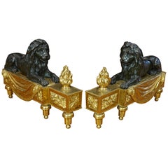 Pair of Louis XVI Style Gilt and Patinated Bronze Lion Chenets or Andirons