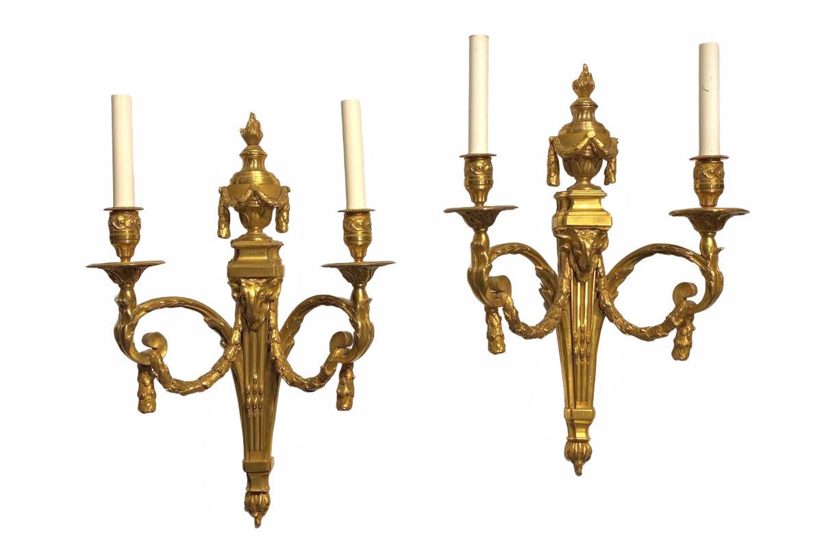 Pair of 19th century French Louis XVI style gilt bronze 2-light sconces.