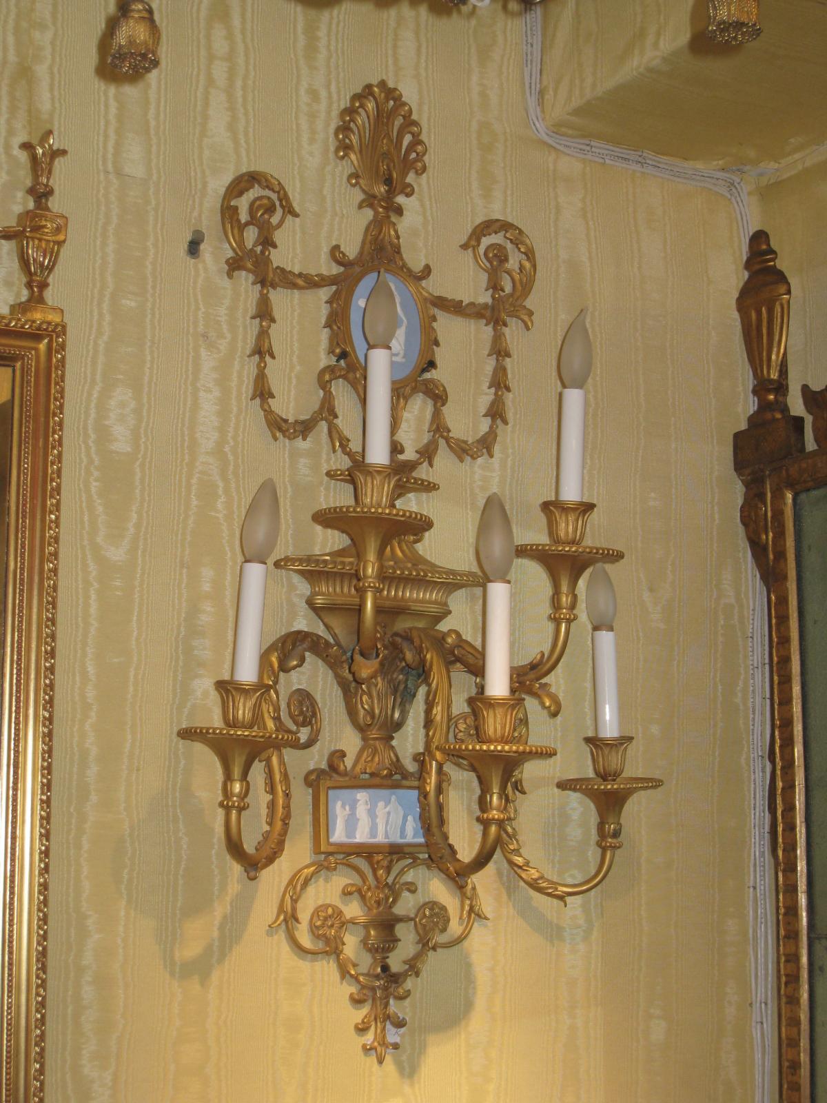 Exceptional pair of large Louis XVI style gilt bronze five-light wall lights with blue neoclassical jasper plaques.