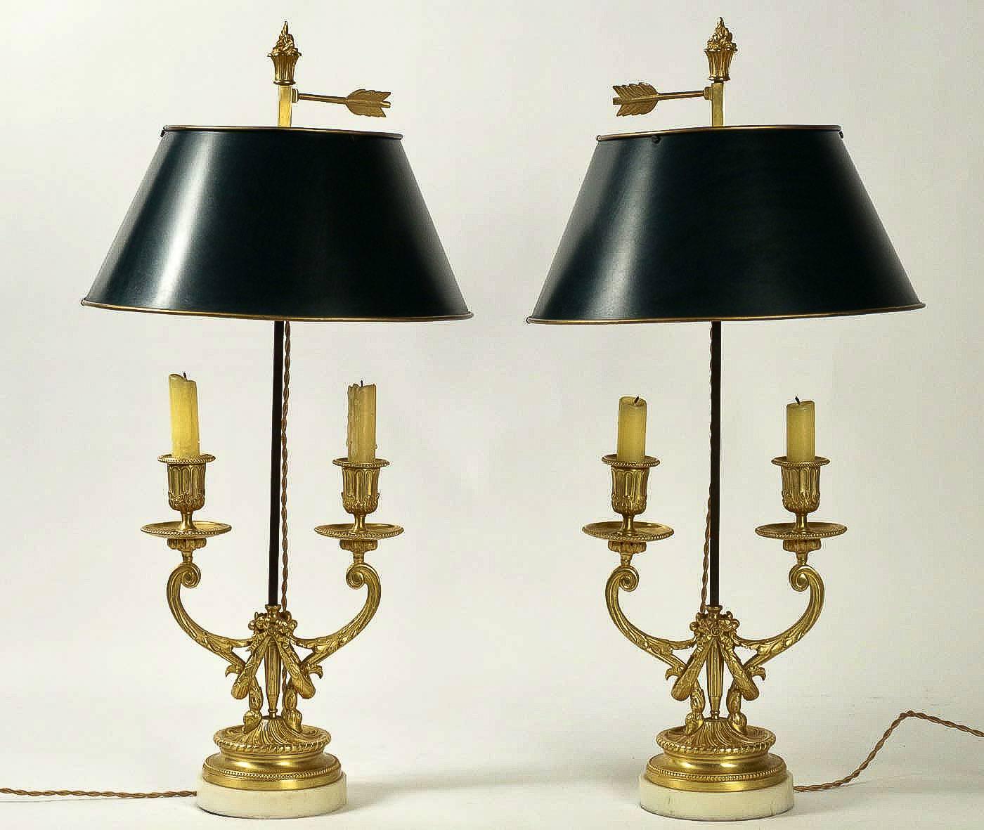 We are pleased to present you, a beautiful French Louis XVI style gilt bronze two-light candelabra rest on a circular bases in white Carrara marble, converted to table Bouillote lamps with a new metal shades. 

Our Bouillote lamps are in perfect