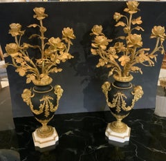 Pair of Louis XVI Style gilt bronze five light candelabra, 19 th c.