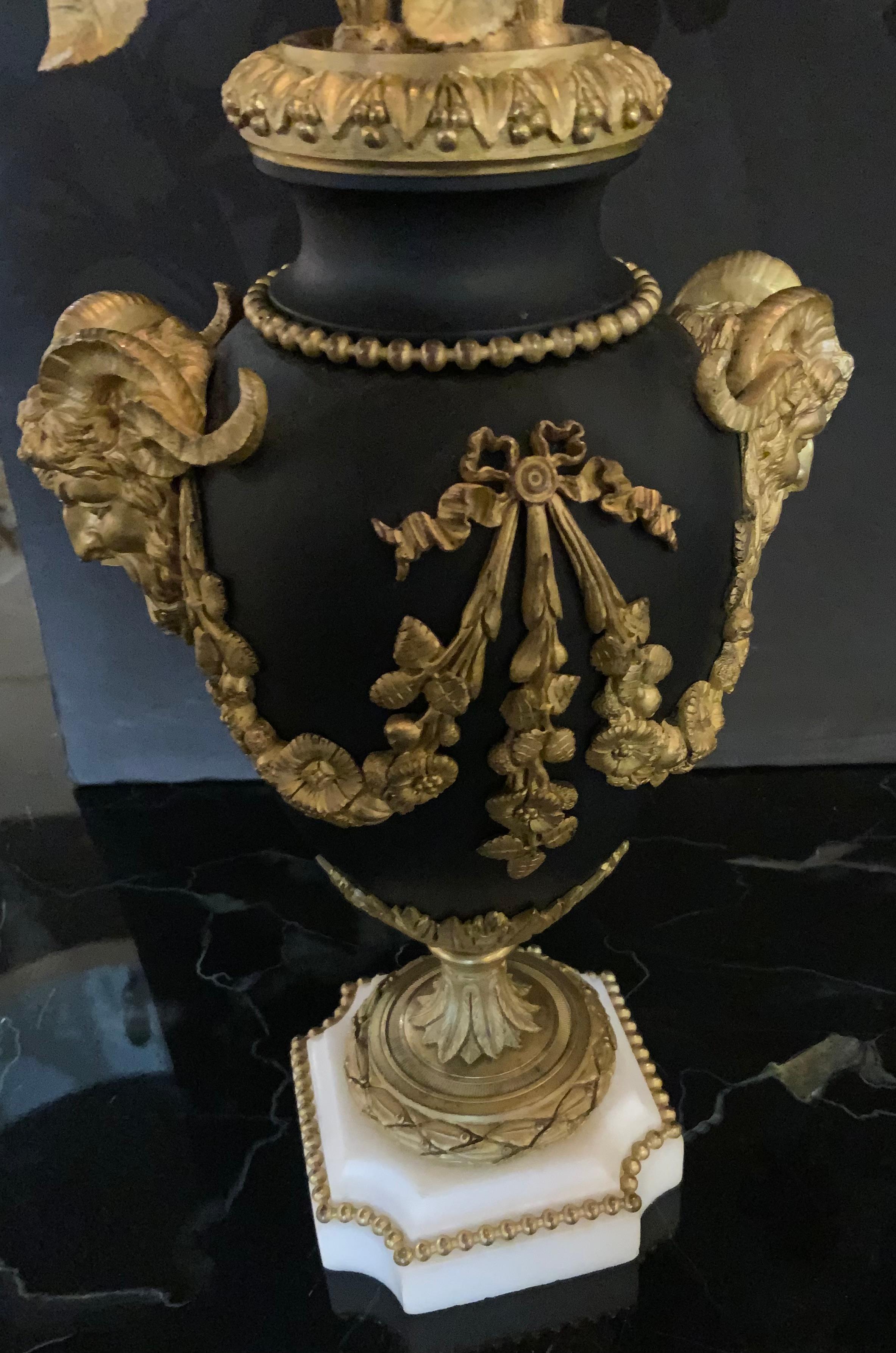 Belgian Black Marble Pair of Louis XVI Style gilt bronze five light candelabra, 19 th c. For Sale