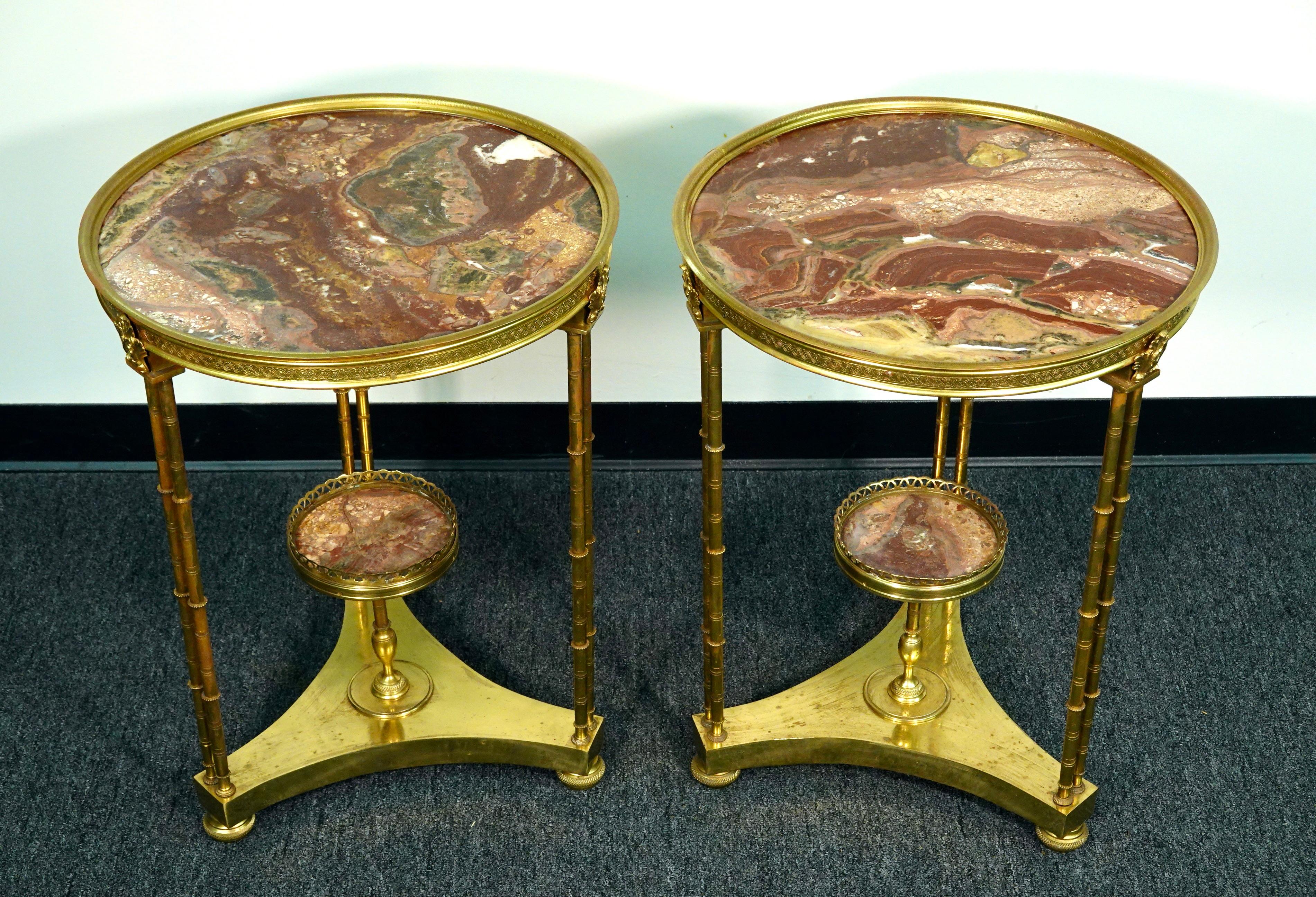 A pair of French Louis XVI style gilt-bronze gueridon tables with lovely variegated marble tops, after the model by Adam Weisweiler (Master, 1778) (French, circa mid-20th century).  Each of these elegant gueridons has a circular breche d'alep marble