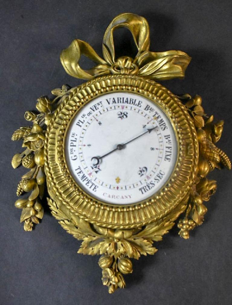Pair of 19 century French Louis XVI style gilt bronze wall clock and barometer signed: Passements Frer du Roy.
 