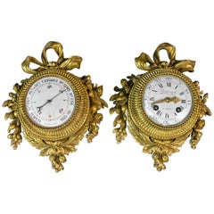 Pair of Louis XVI Style Gilt Bronze Wall Clocks and Barometer