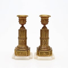 Antique Pair of Louis XVI Style Gilt Metal and Alabaster Candlesticks
