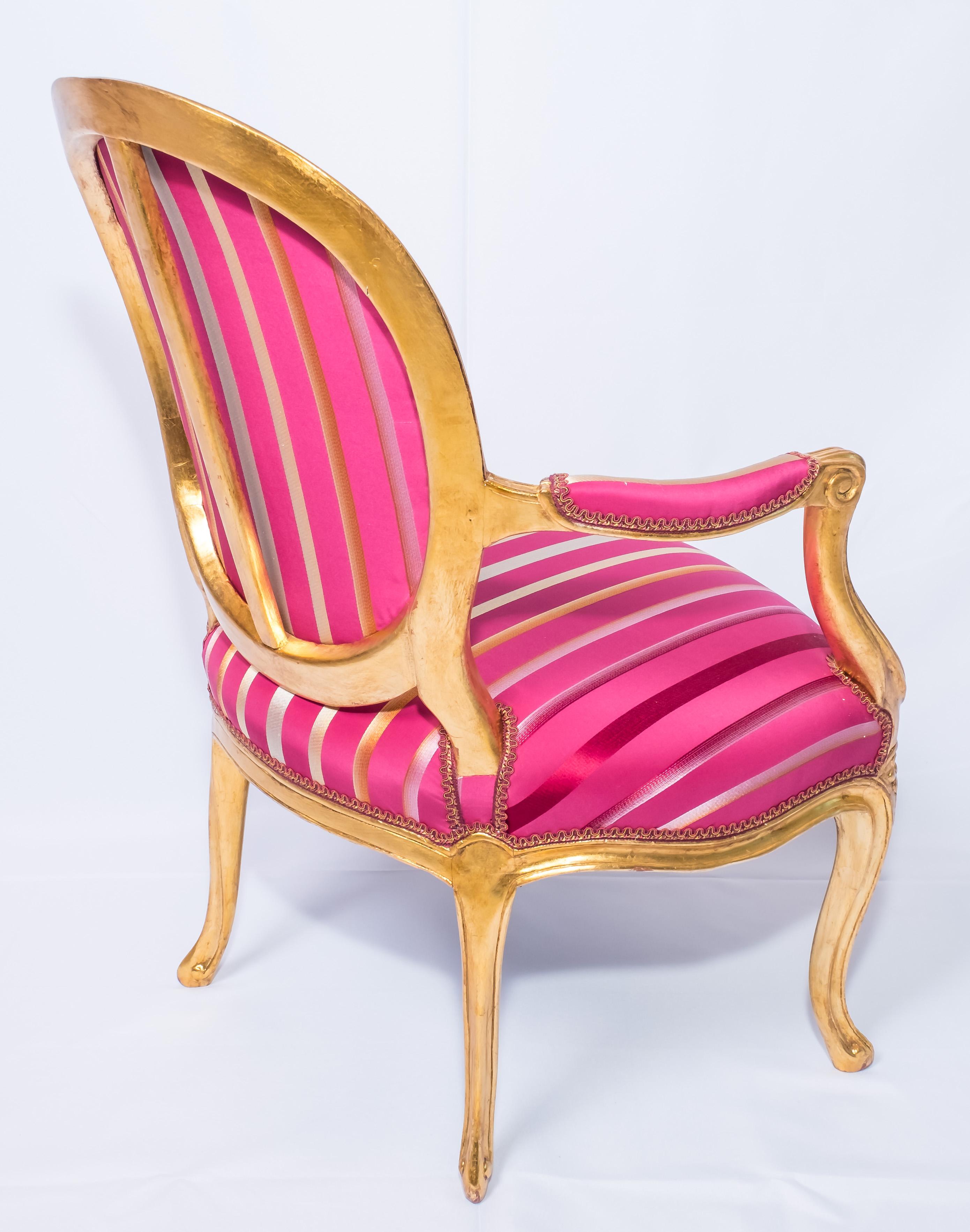 Silk *B Pair of Louis XVI style magenta armchairs. French, early 20th Century.