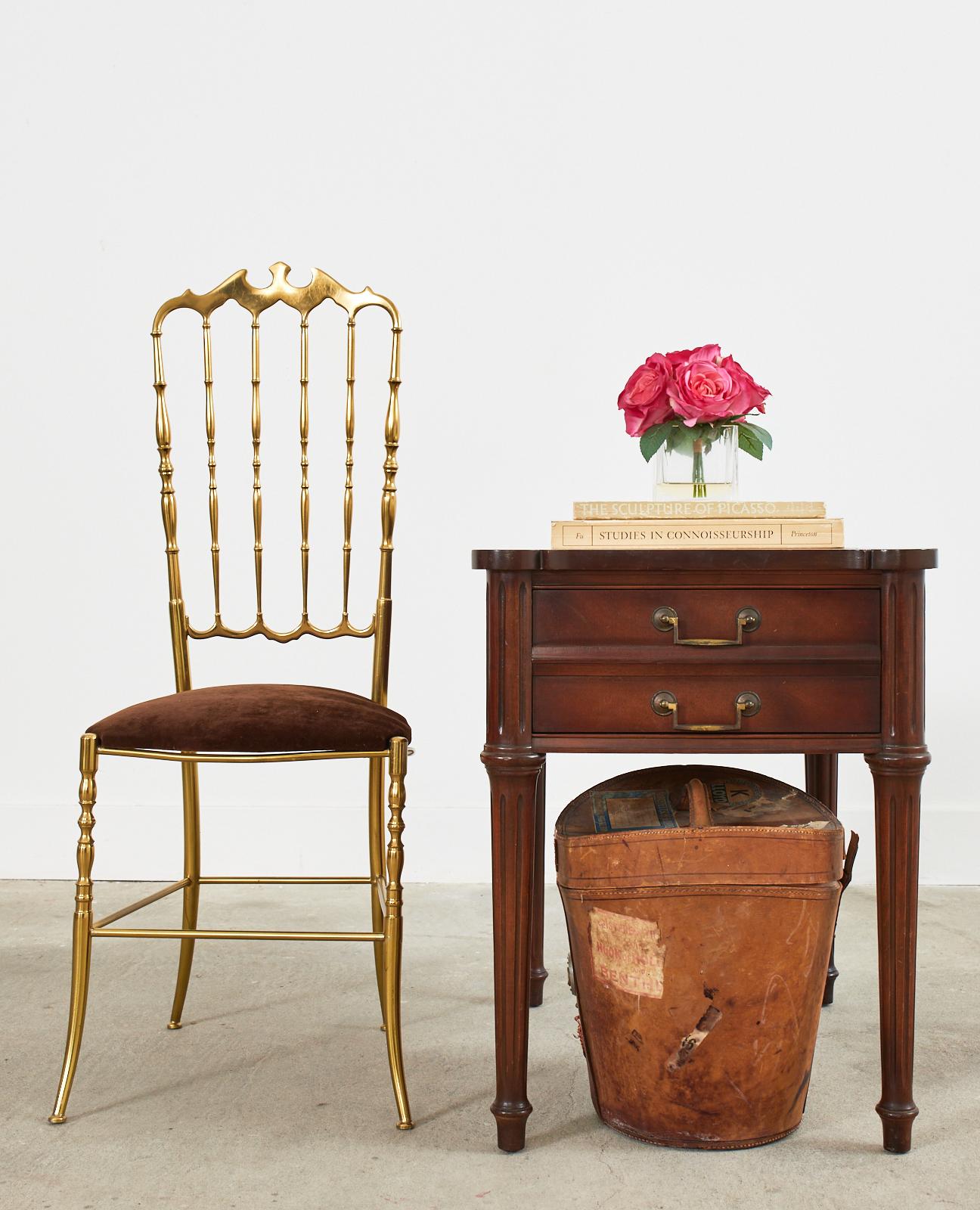 Distinctive pair of French mahogany nightstands or end tables featuring embossed, tooled leather tops. Made in the Louis XVI taste with a subtle design free from inlay and bronze mounts. The cases have a large storage drawer with double patinated