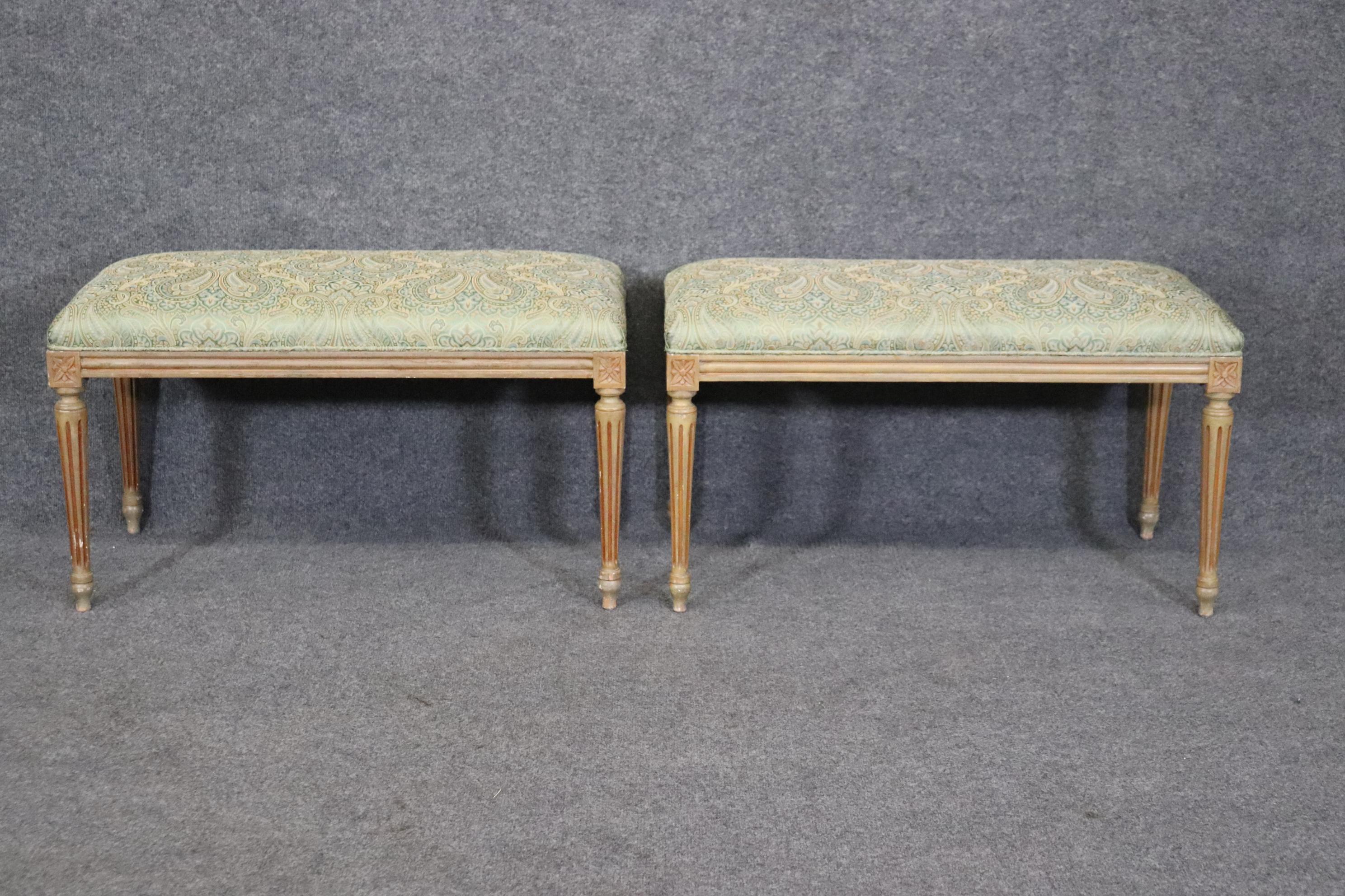 Dimensions: Height: 17 3/4in Width: 31in Depth: 15in

This is a beautiful pair of Louis XVI style distressed and upholstered benches. They were made with one thing in mind and that is quality! We can tell this by the finish that was used on the