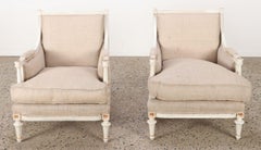 Pair of Louis XVI style painted and gilt bergere chairs C 1950.