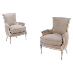 Pair of Louis XVI style painted and gilt Bergere chairs C 1950.