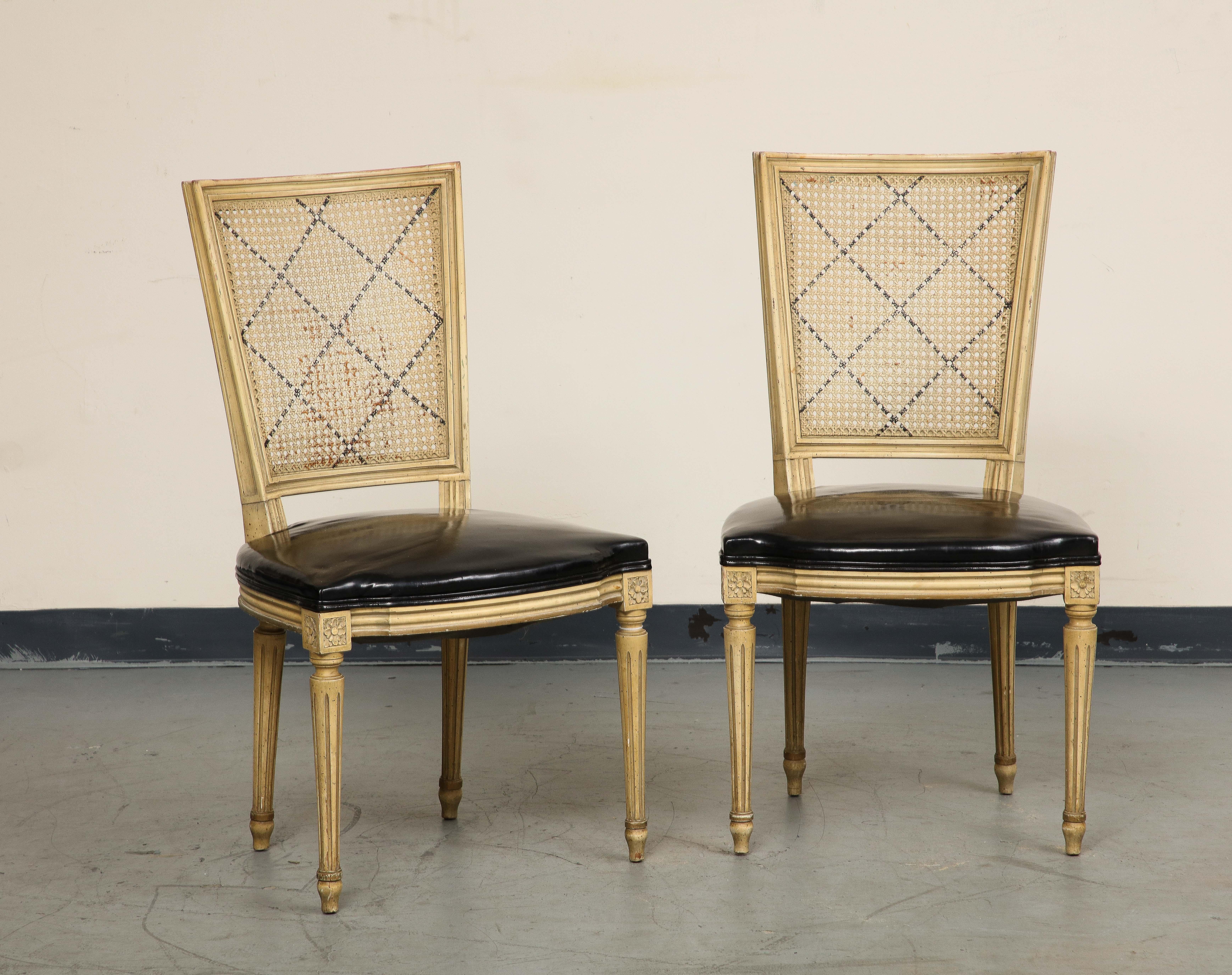 Faux Leather Pair of Louis XVI Style Painted Armchairs & Two Matching Cane Sidechairs For Sale