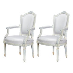 Pair of Louis XVI Style Painted Fauteuils with Carved Floral Crest