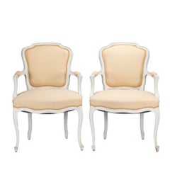 Pair of Louis XVI style painted & upholstered fauteuil, 1910-30