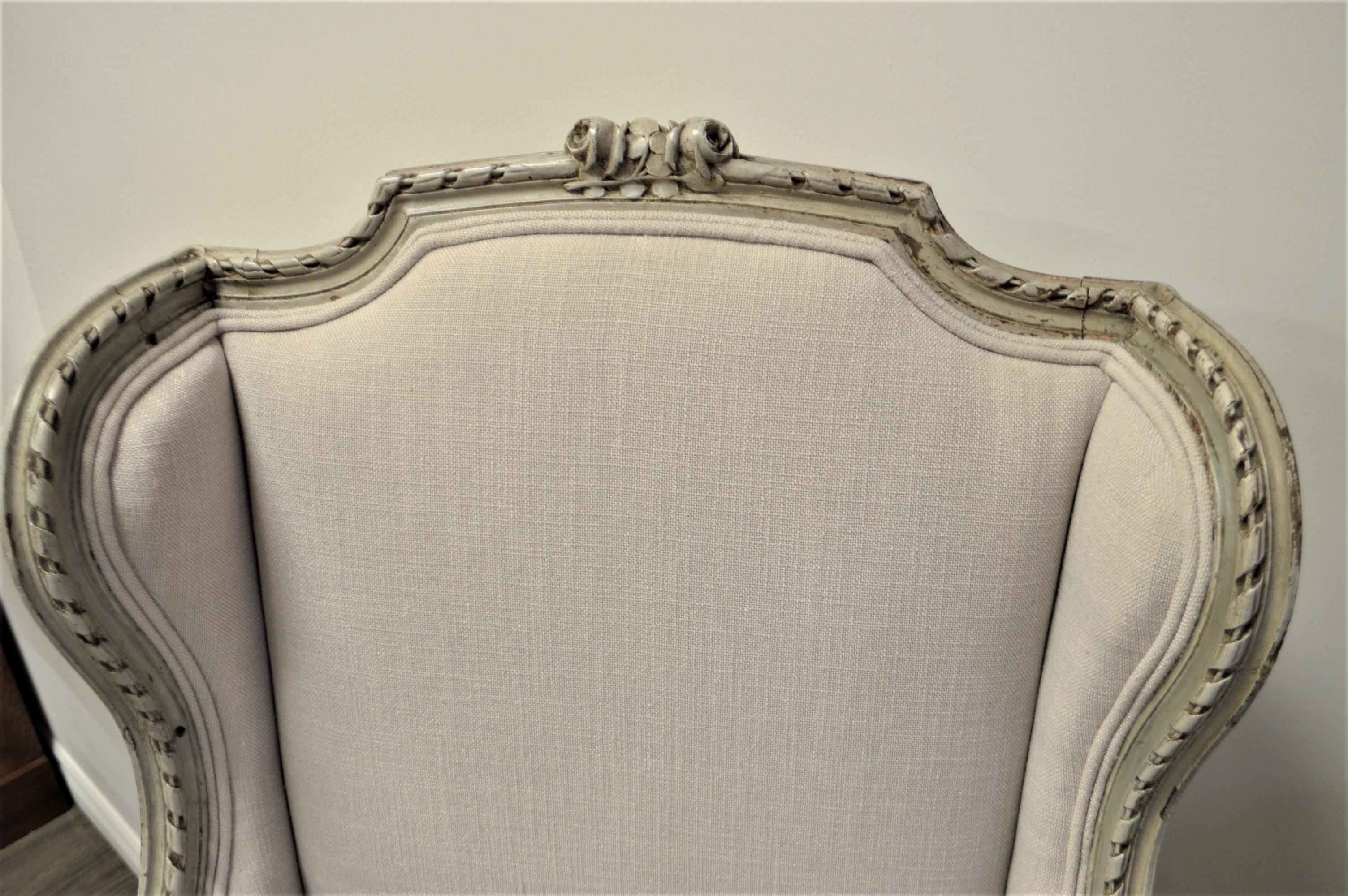 French Pair of Louis XVI Style Painted Wing Chair, Original Frame, Newly Upholstered For Sale