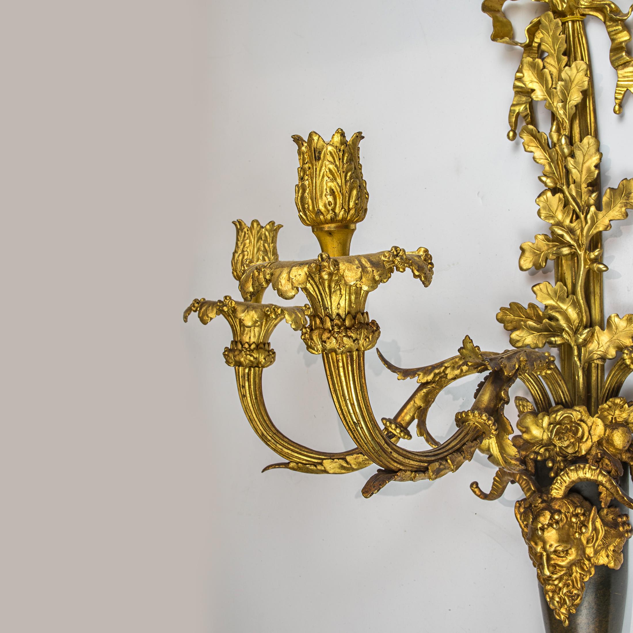 French Pair of Louis XVI Style Three-Light Gilt and Patinated Bronze Wall Sconces For Sale