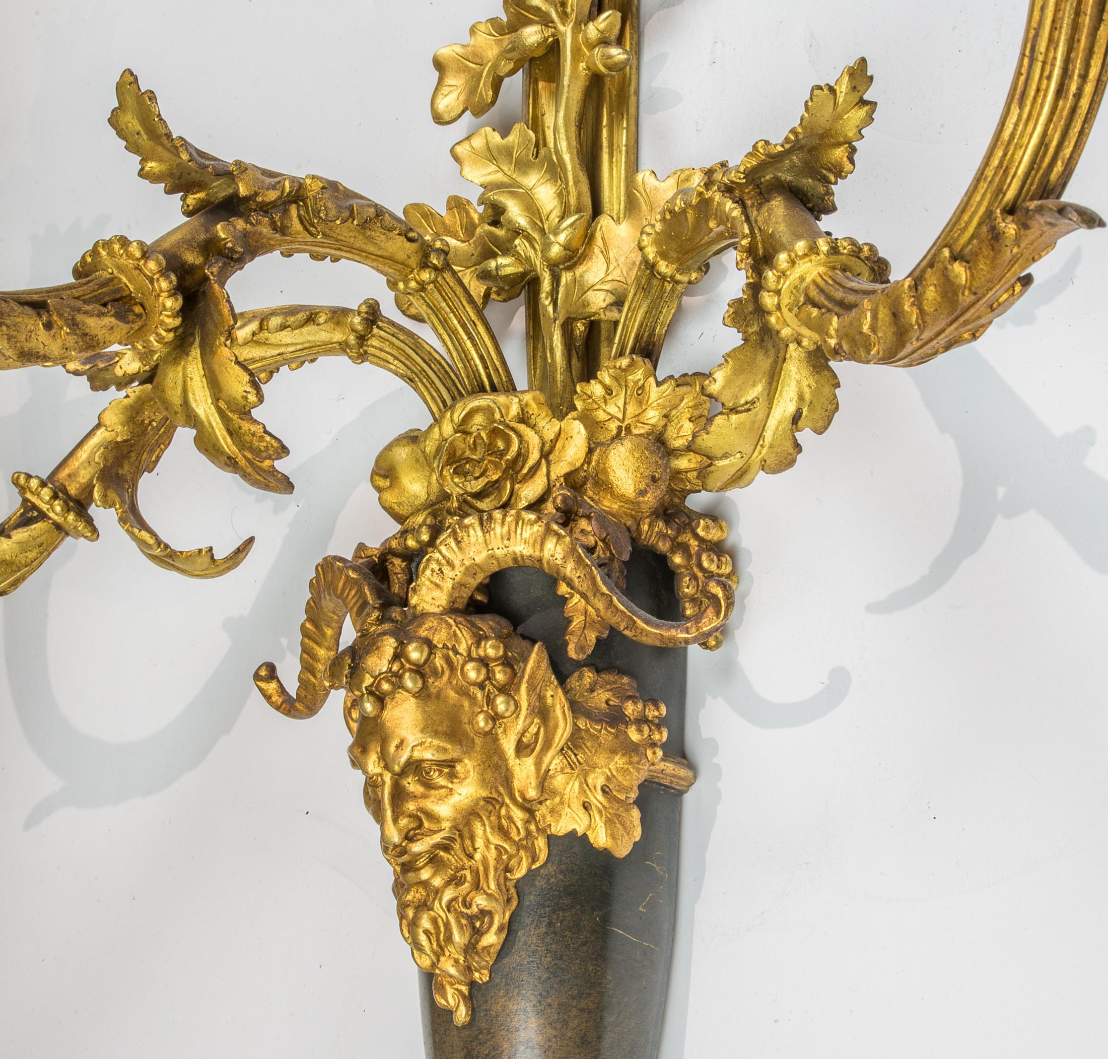 Pair of Louis XVI Style Three-Light Gilt and Patinated Bronze Wall Sconces In Excellent Condition For Sale In New York, NY