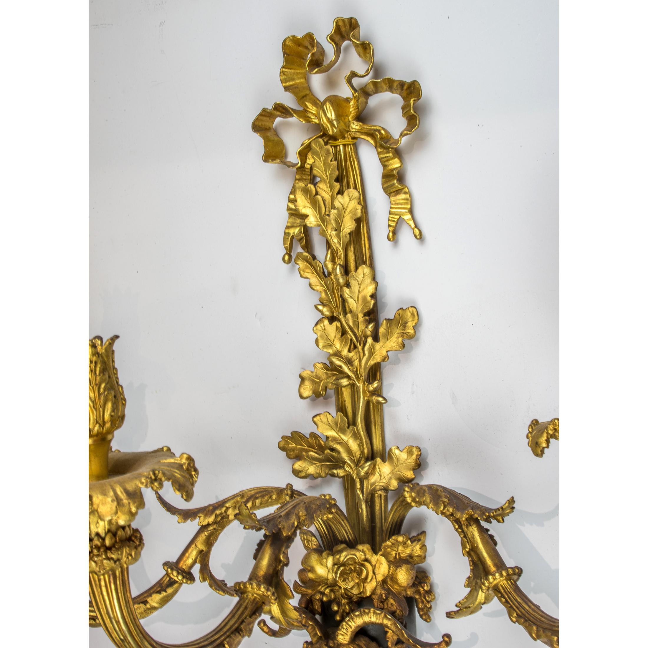 Pair of Louis XVI Style Three-Light Gilt and Patinated Bronze Wall Sconces For Sale 1