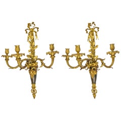 Antique Pair of Louis XVI Style Three-Light Gilt and Patinated Bronze Wall Sconces