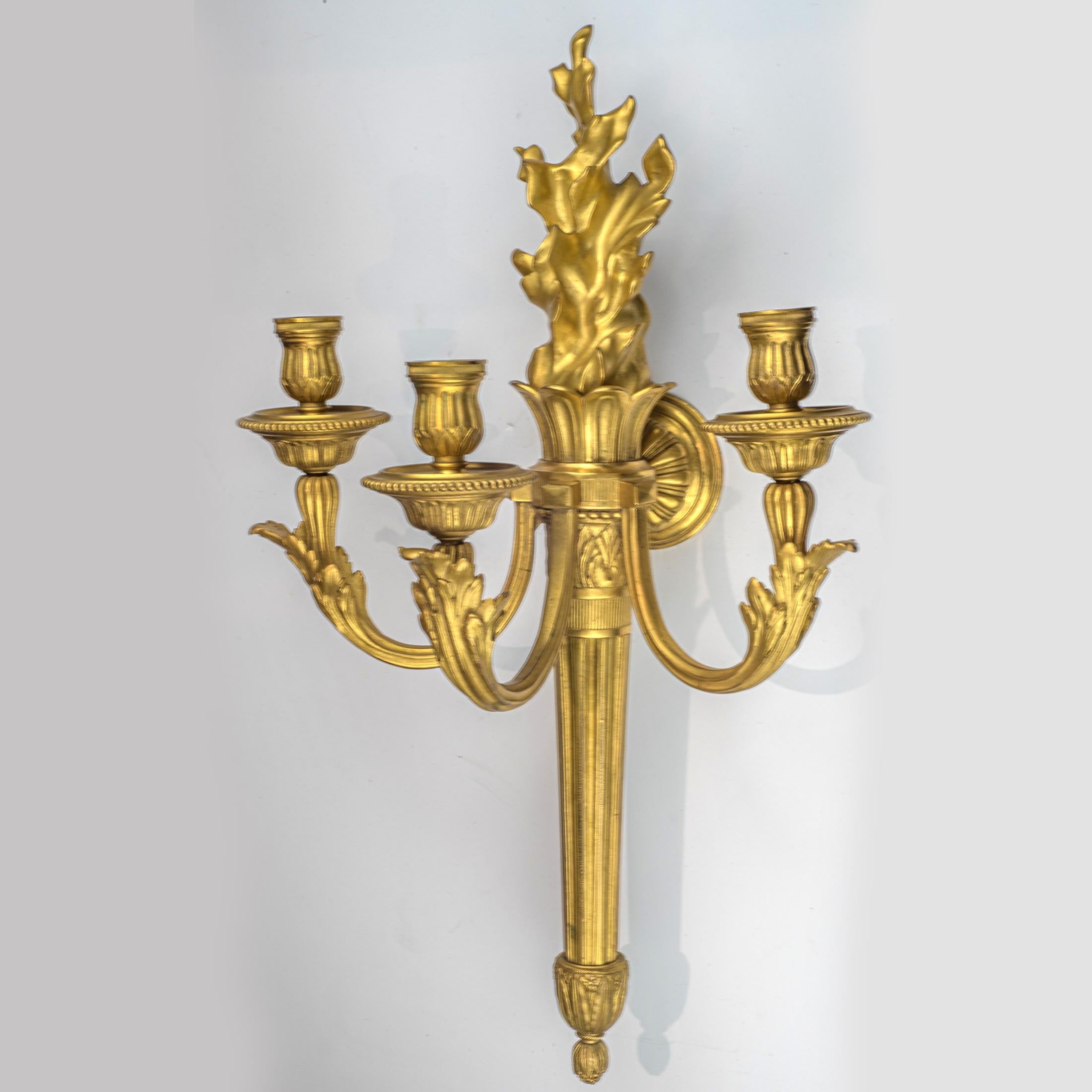 A fine quality pair of Louis XVI Style three-light gilt bronze wall sconces after the well known model by Jean-Louis Prieur, Paris. The gilt bronze elements variously impressed EM, numbered and with the mark BY. Signed 'E. MOTTHEAU, PARIS'

Maker: