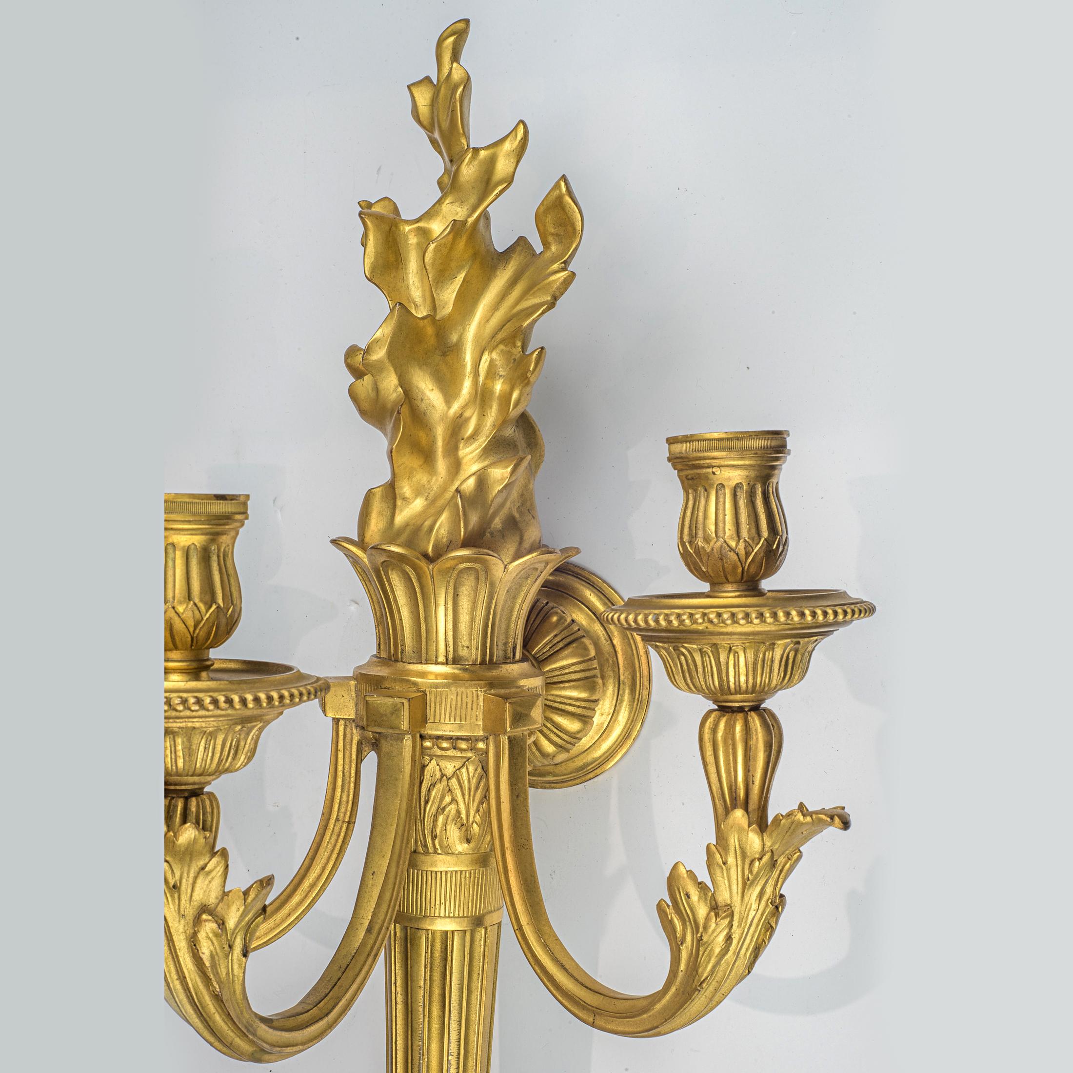 French Pair of Louis XVI Style Three-Light Gilt Bronze Wall Sconces For Sale