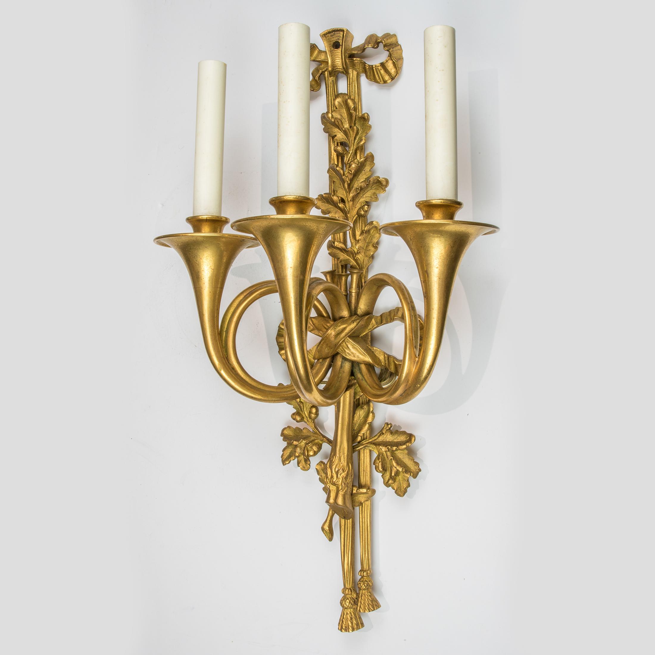 French Pair of Louis XVI Style Three-Light Gilt Bronze Wall Sconces For Sale