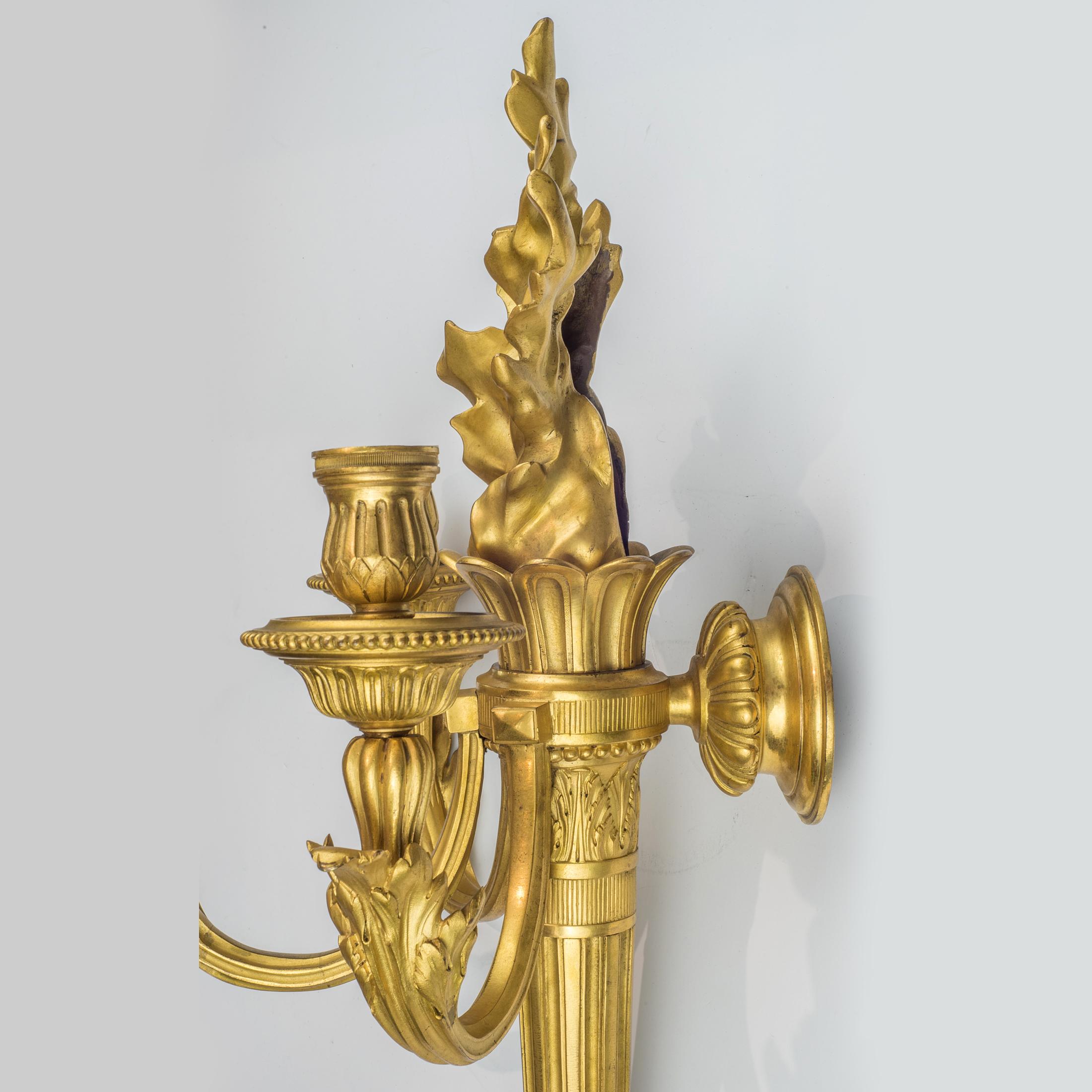 Pair of Louis XVI Style Three-Light Gilt Bronze Wall Sconces In Excellent Condition For Sale In New York, NY